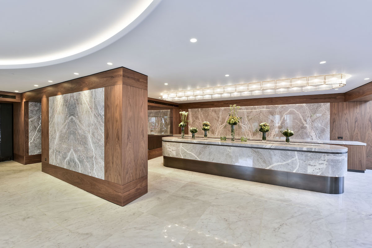 Nine Kings Suite reception, modern marble design for corporate events and networking.