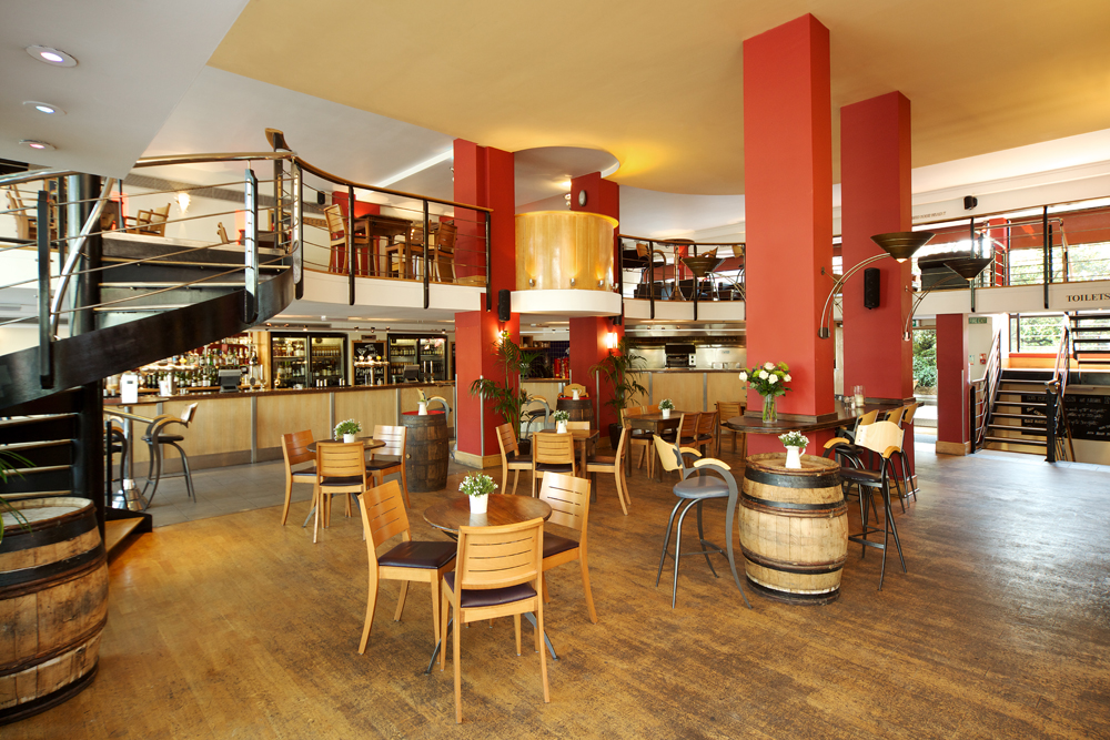 The Mezzanine in Wine Tun: modern event space with warm wood floors, perfect for workshops.