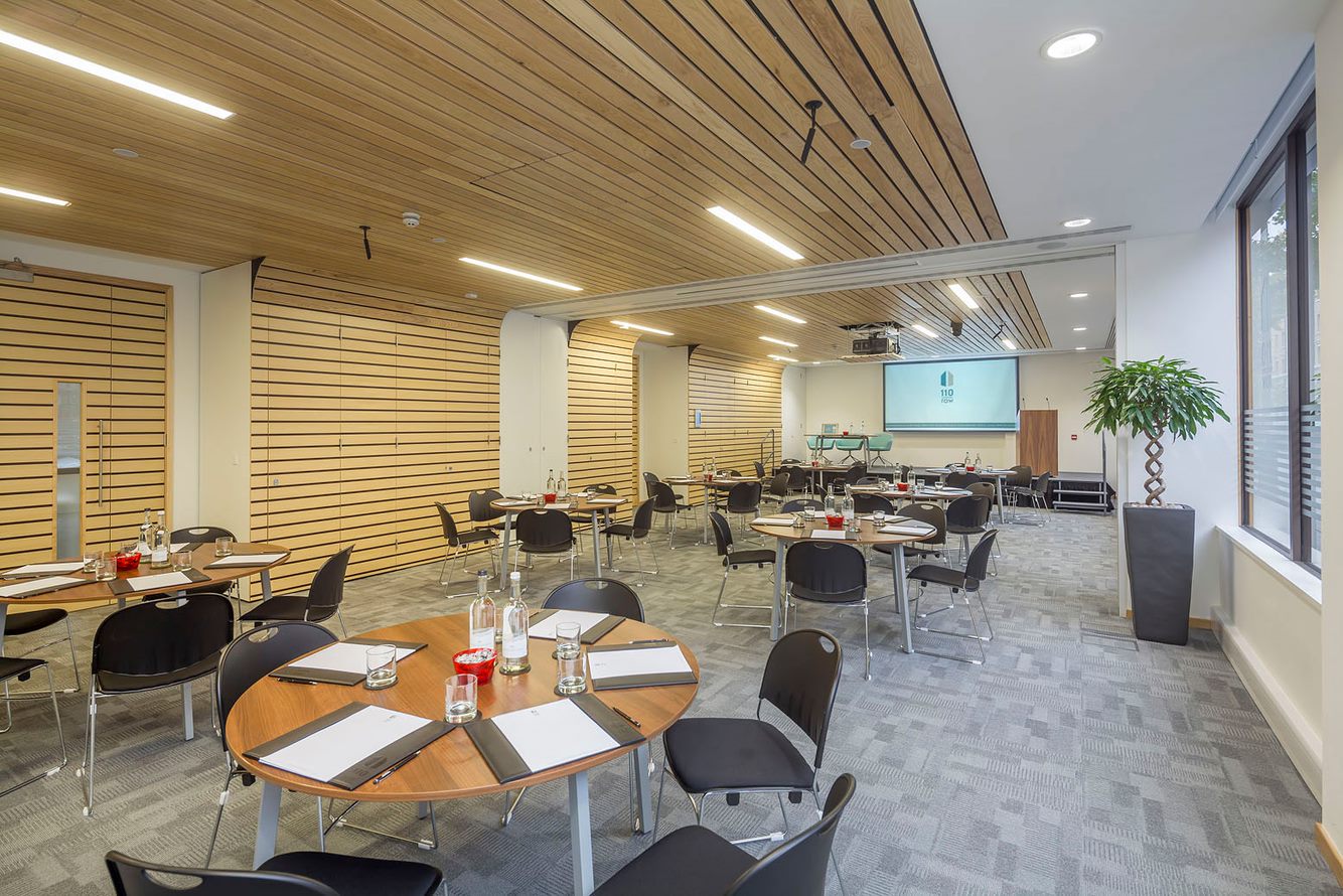 Rippington Suite meeting space with round tables, ideal for corporate events and workshops.