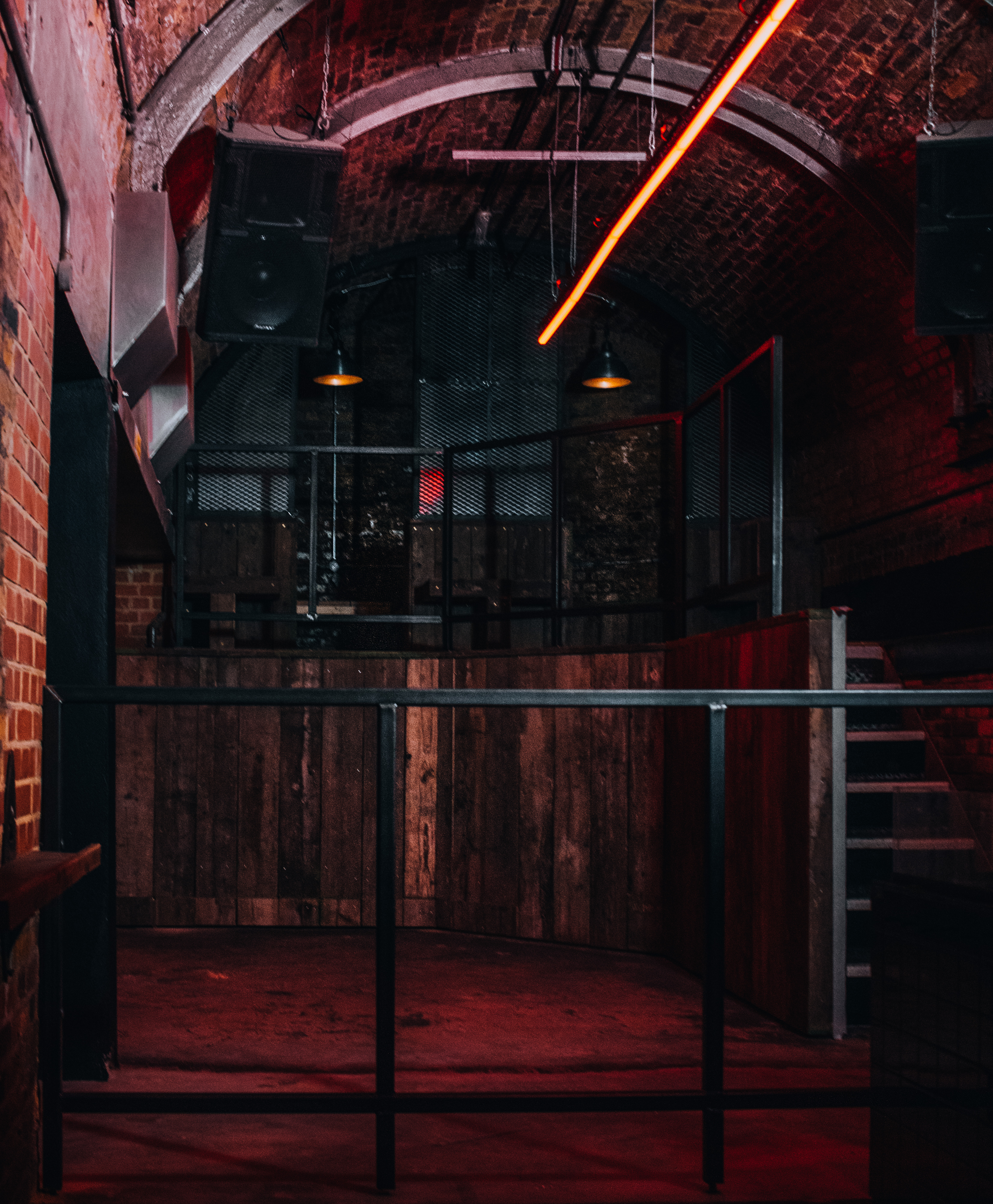 Industrial event space with exposed brick, ideal for networking and gatherings.