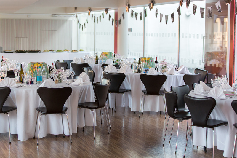 St Paul's Roof Pavilion set for a formal dinner with elegant tables and modern decor.