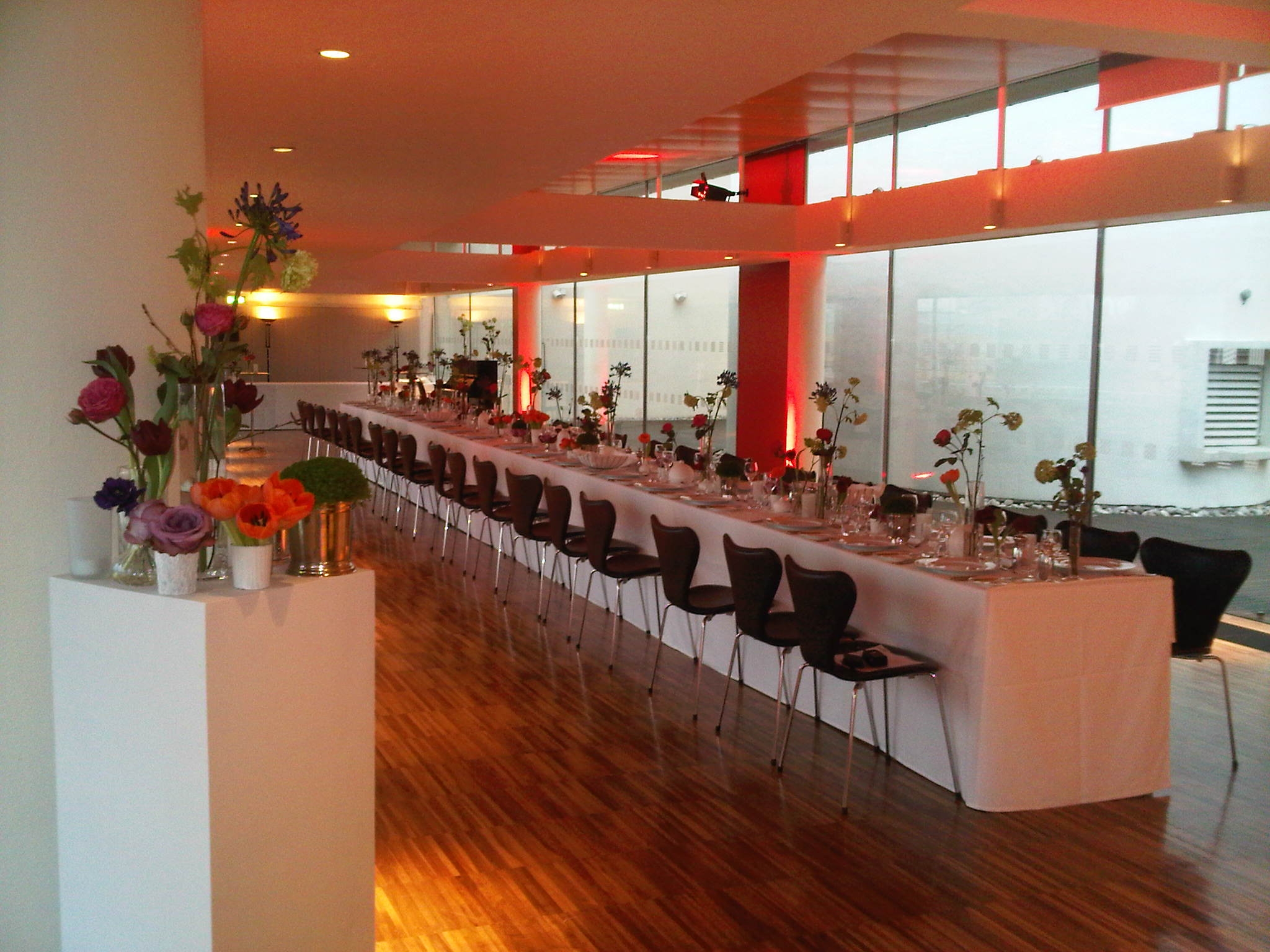 St Paul's Roof Pavilion set for a formal dinner with floral centerpieces, ideal for events.