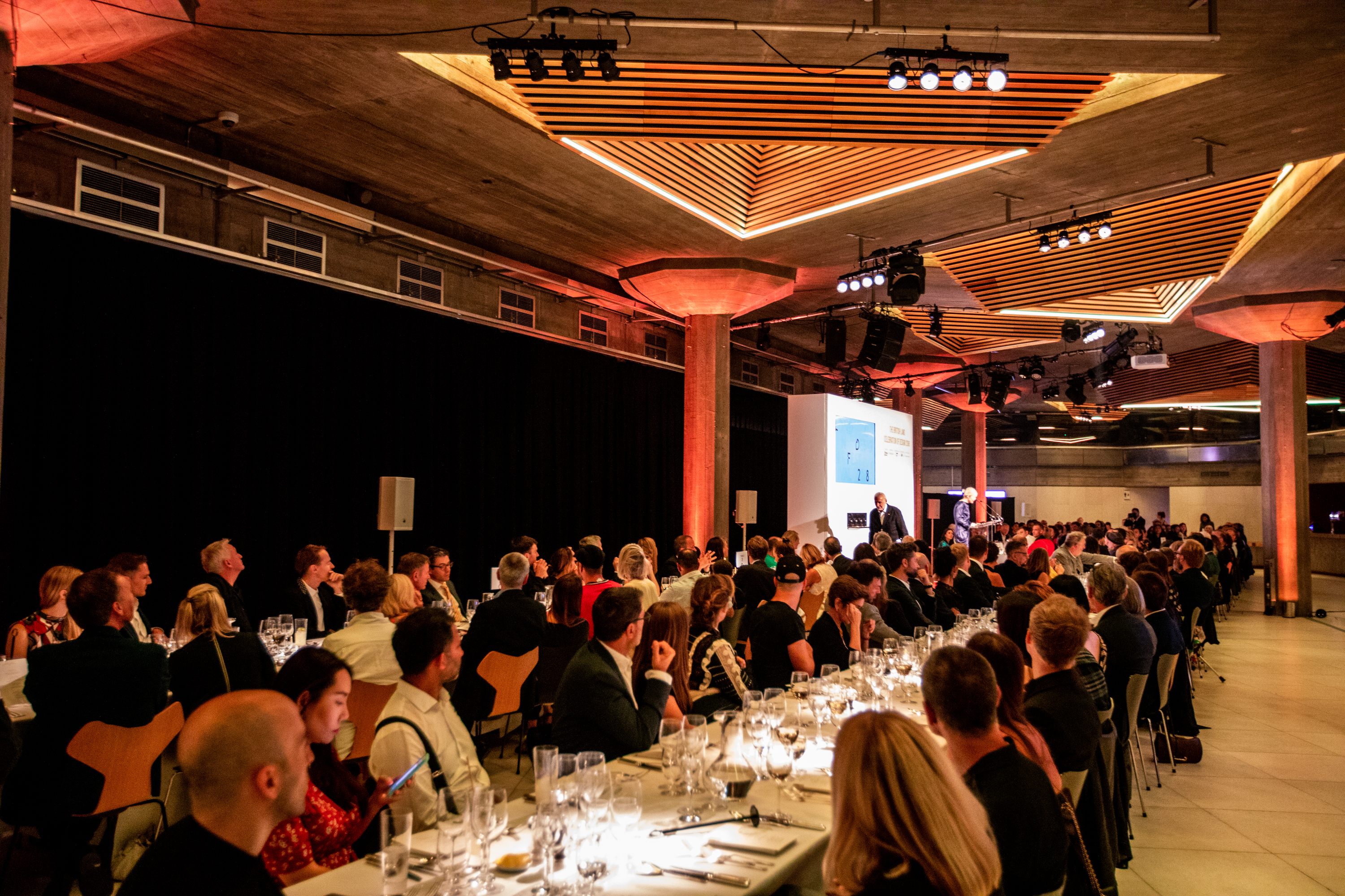 Queen Elizabeth Hall Foyer set for a formal dinner event with ambient lighting.