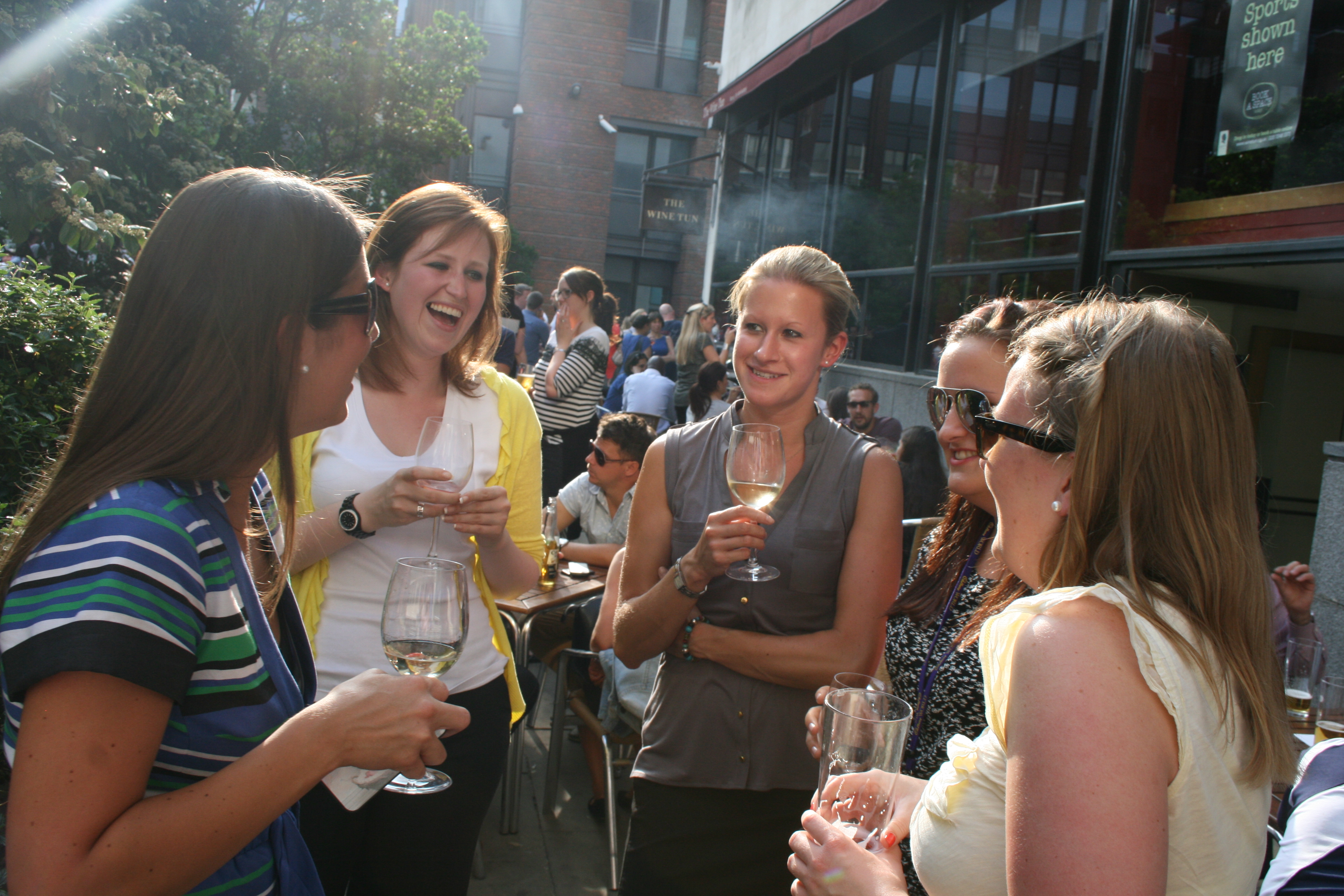 Vibrant outdoor networking event in a lush garden setting, fostering connections and engagement.