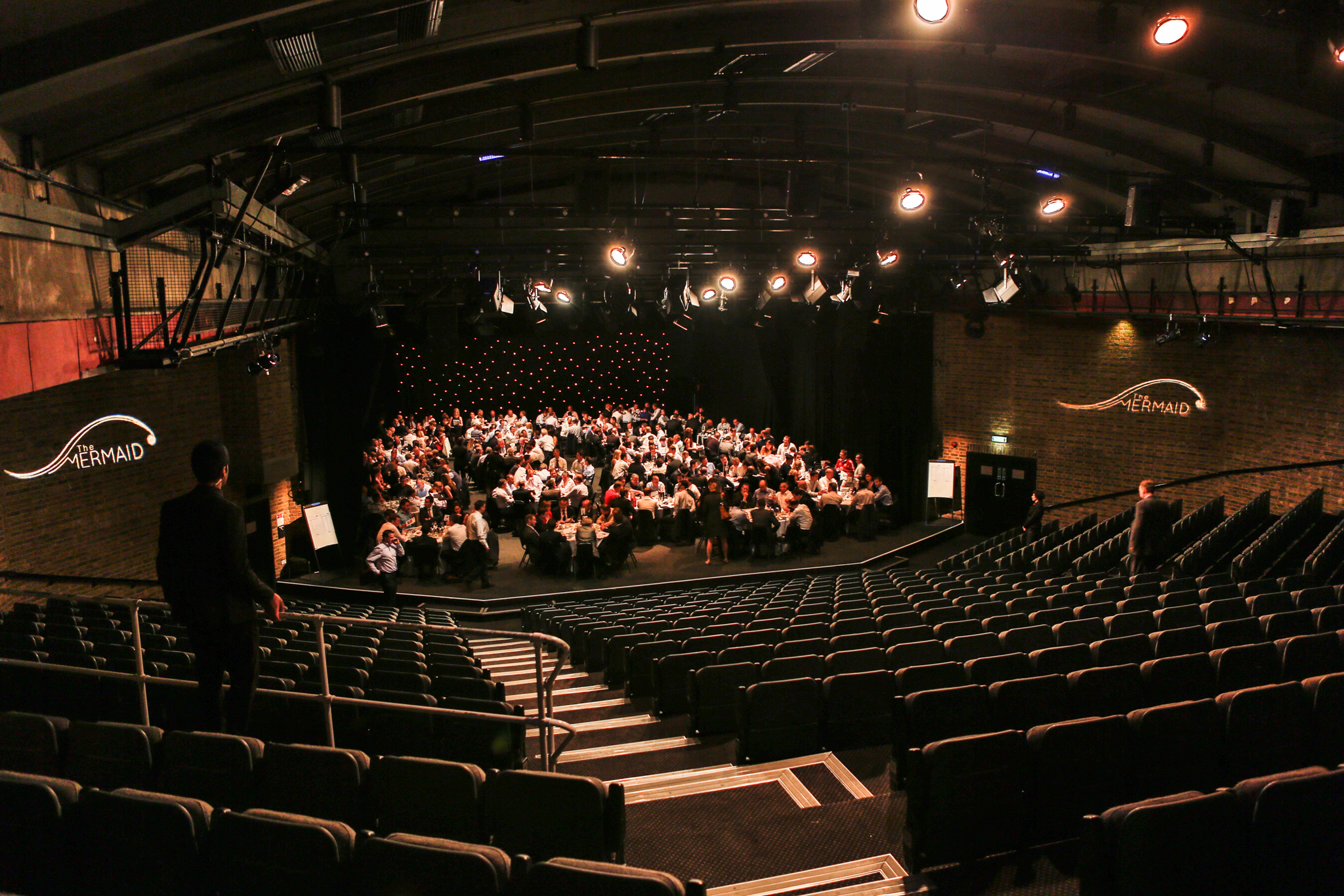 Auditorium in The Mermaid London with tiered seating for corporate events and conferences.