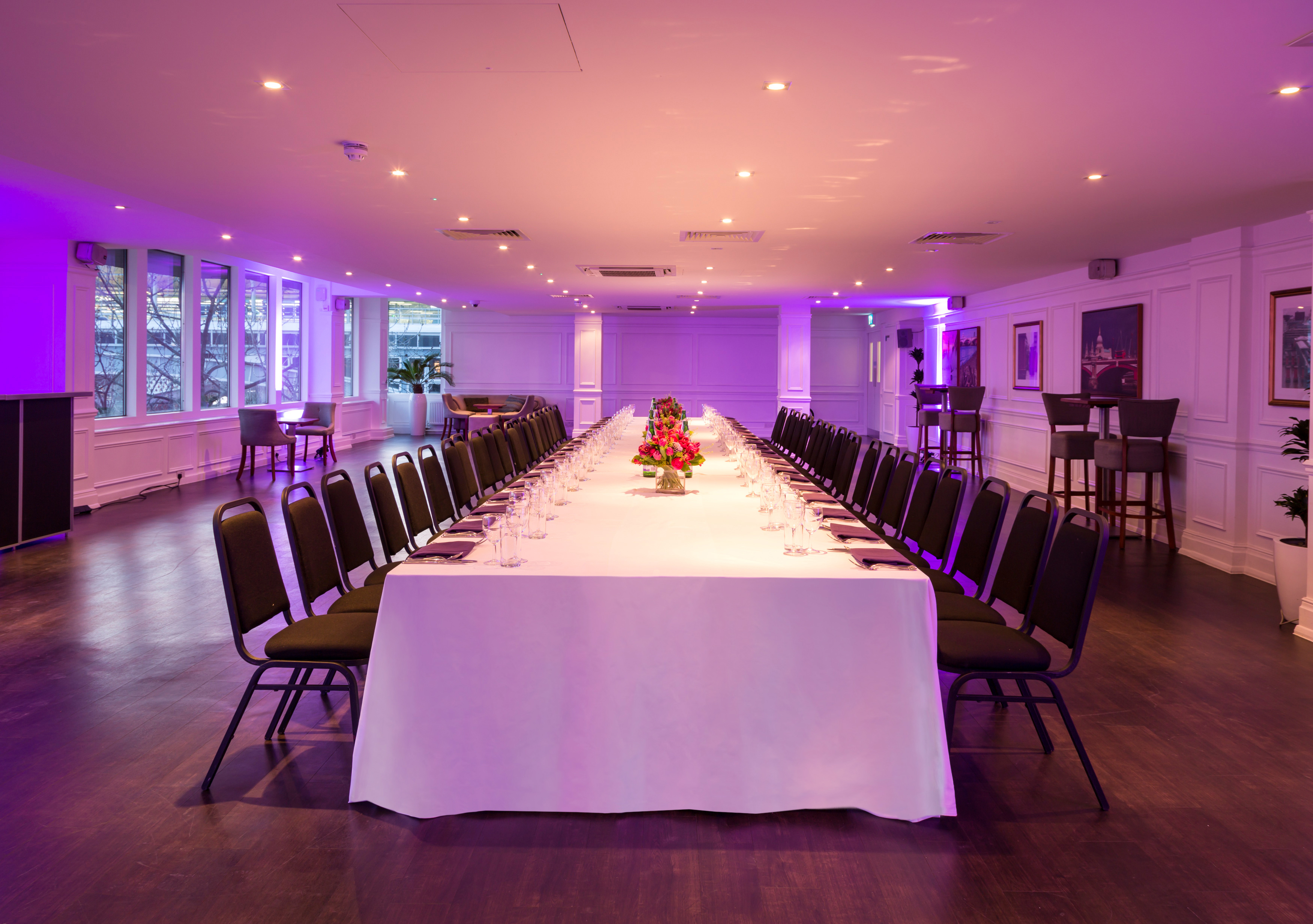Lower River Room at The Mermaid London, elegant table setup for corporate events.