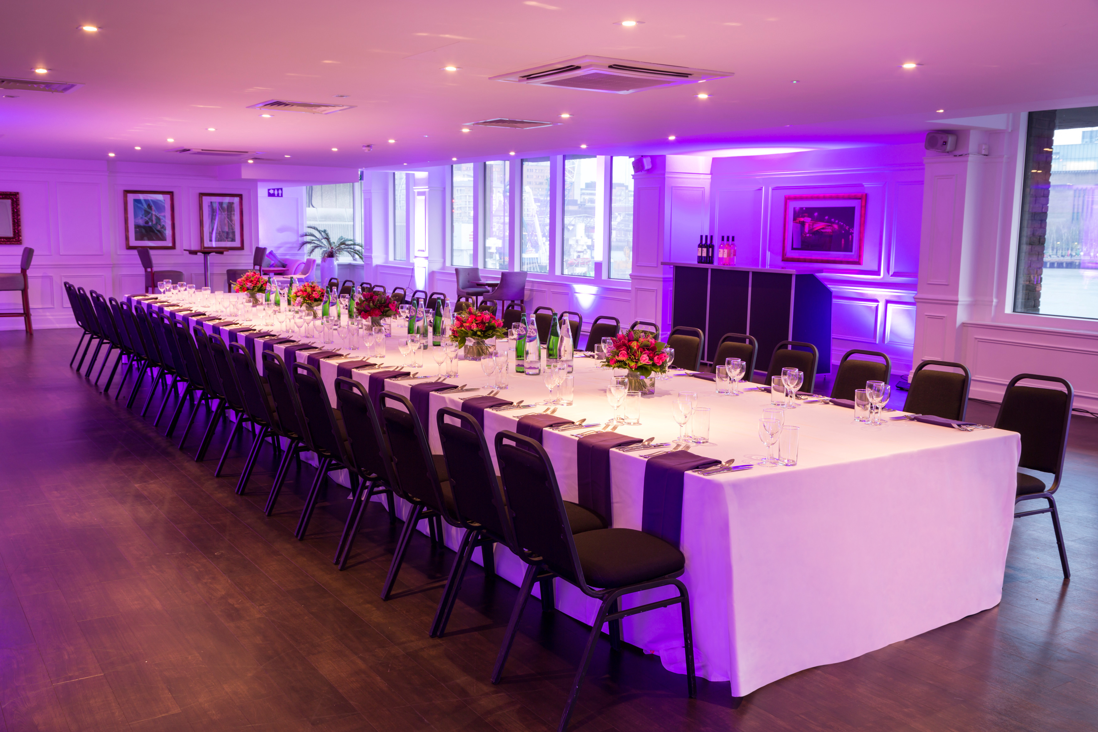 Elegant banquet setup in Lower River Room, The Mermaid London for corporate events.