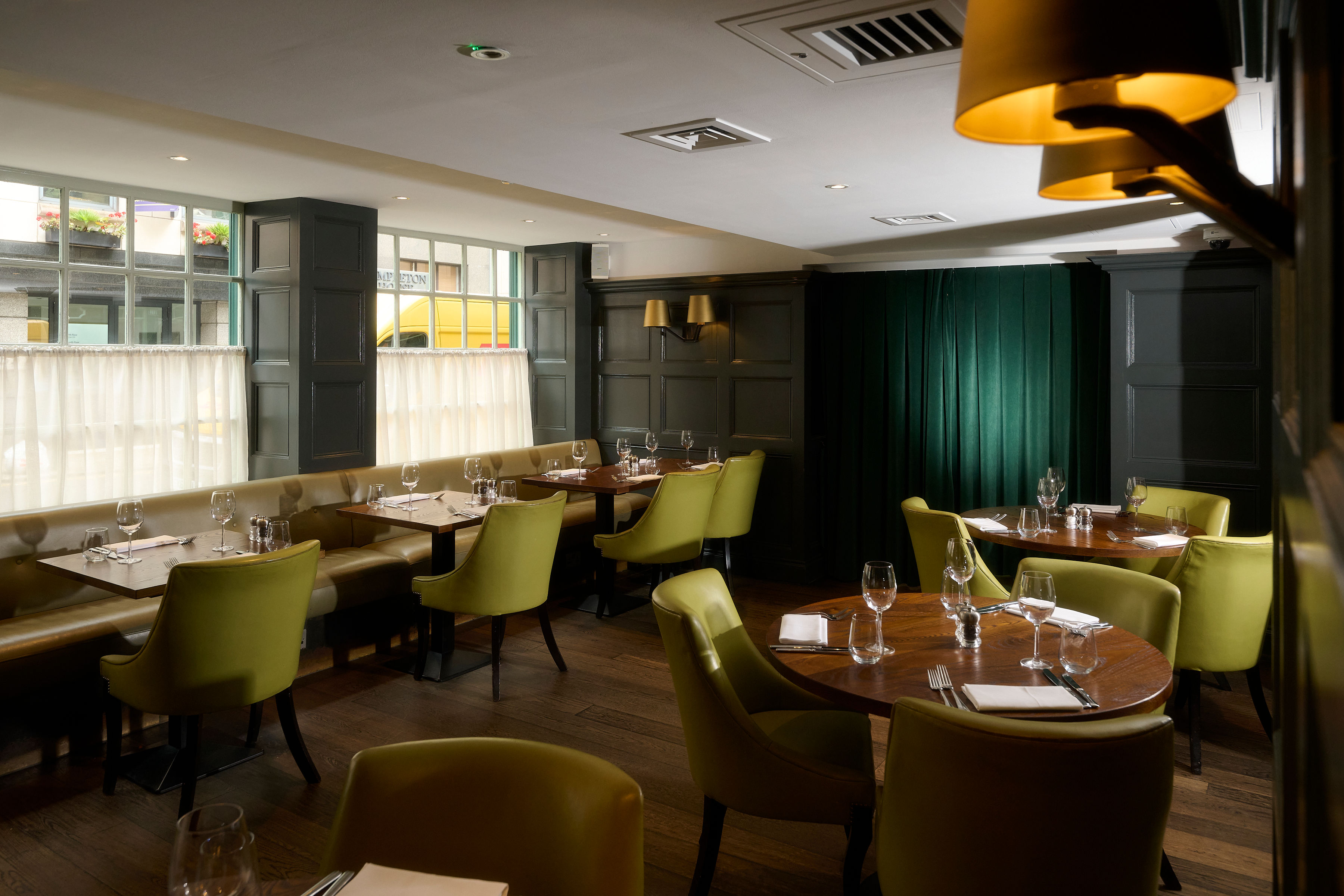 Sophisticated dining venue with warm lighting for intimate meetings and networking events.