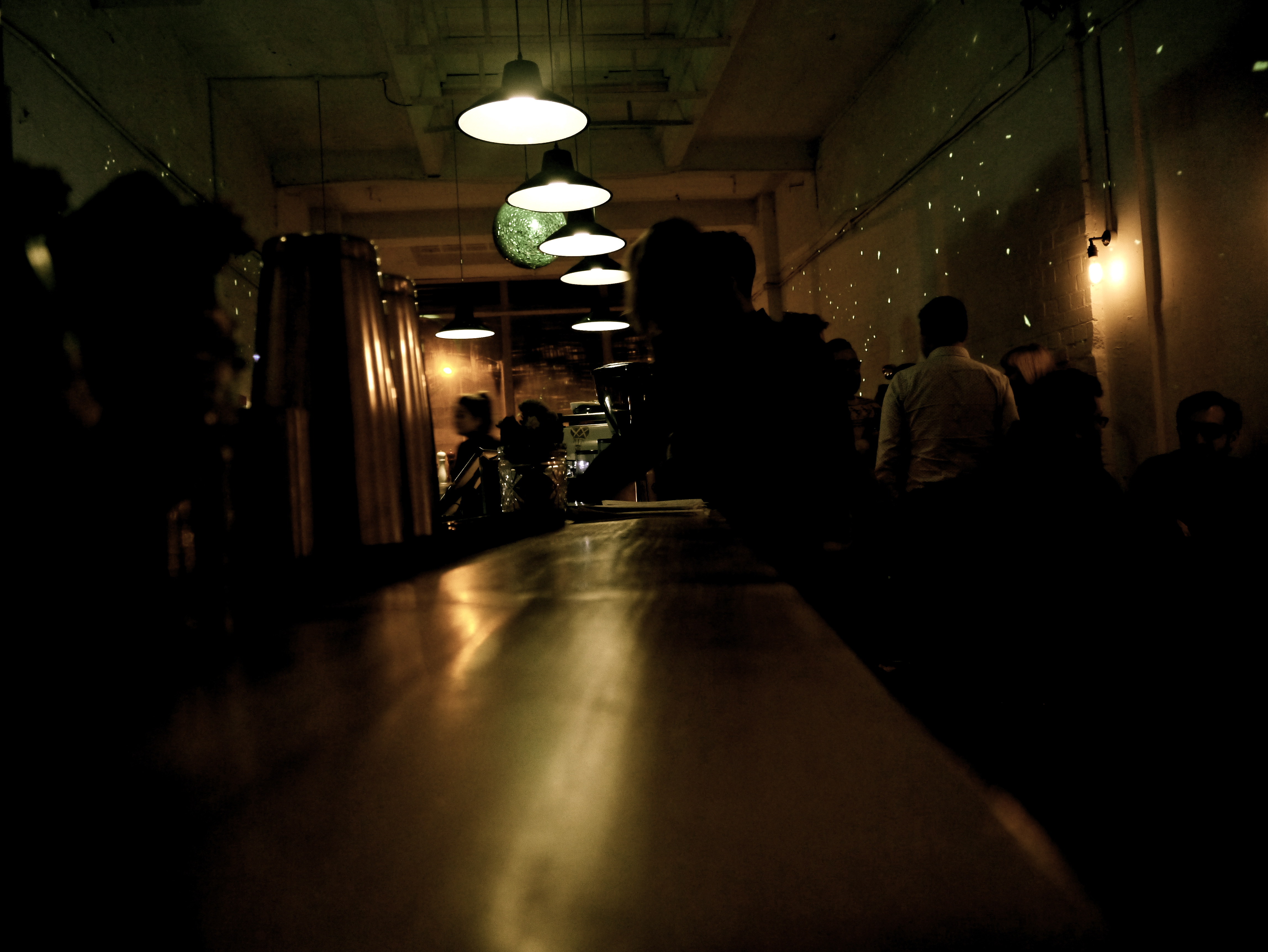 "Cafe in Craving Coffee: lively event space with inviting ambiance for networking functions."