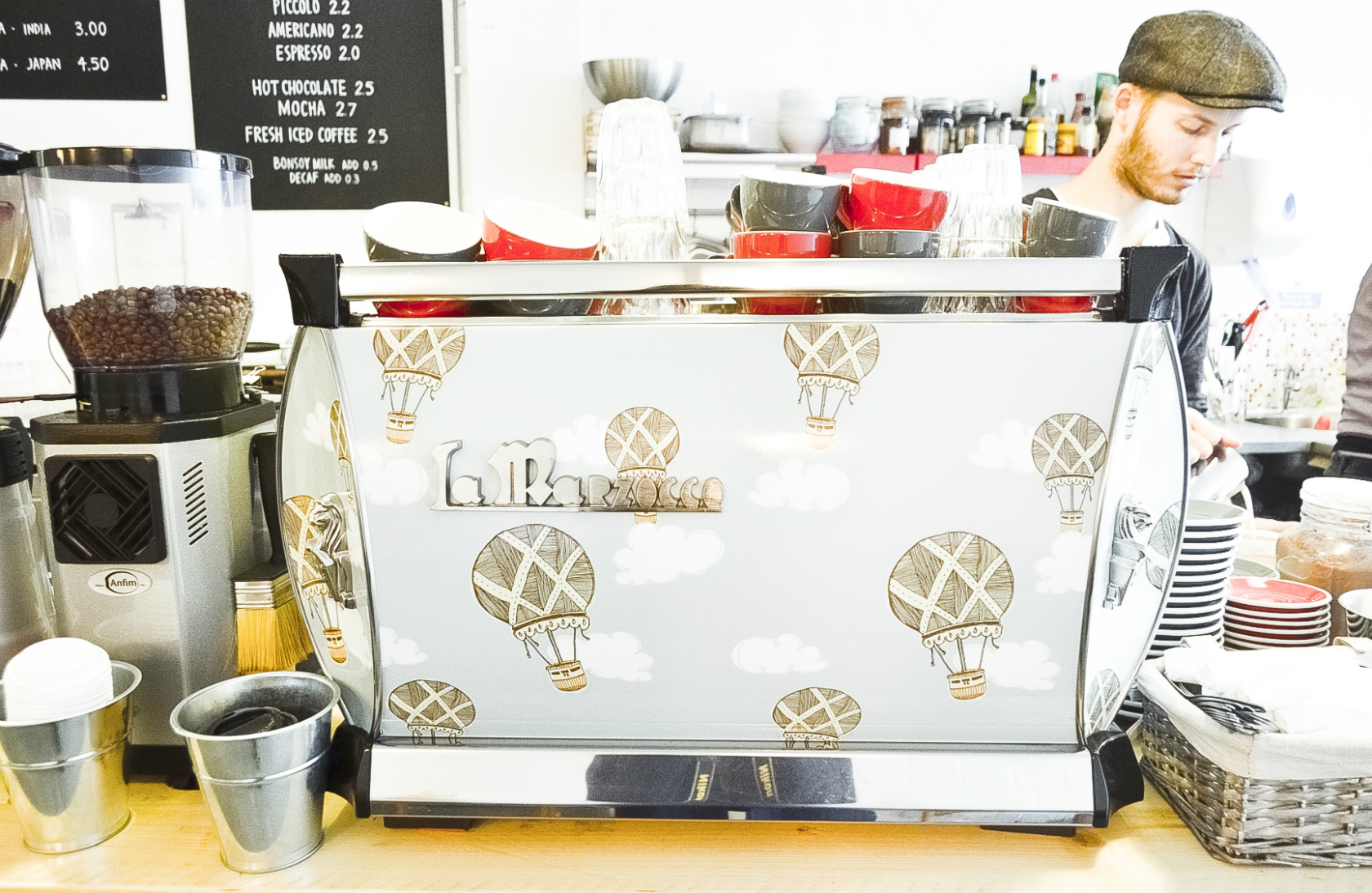 Stylish coffee station with hot air balloon espresso machine for events and networking.