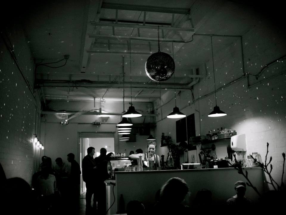Stylish event space at Craving Coffee with disco ball, perfect for cocktail receptions.
