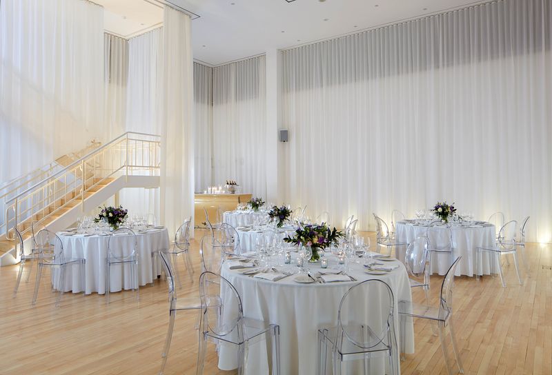 Elegant event space in Sanderson London with round tables, ideal for weddings and corporate events.