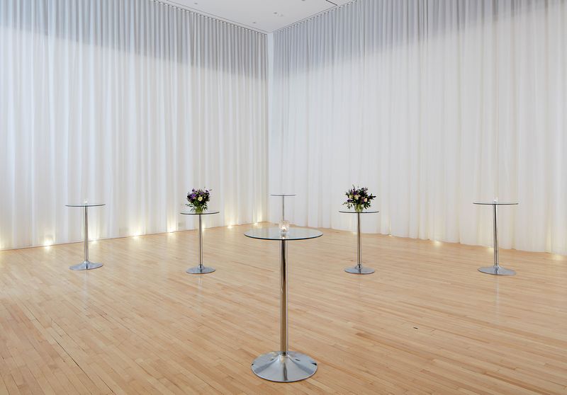 Minimalist event space in Sanderson London with polished wood floors, ideal for gatherings.