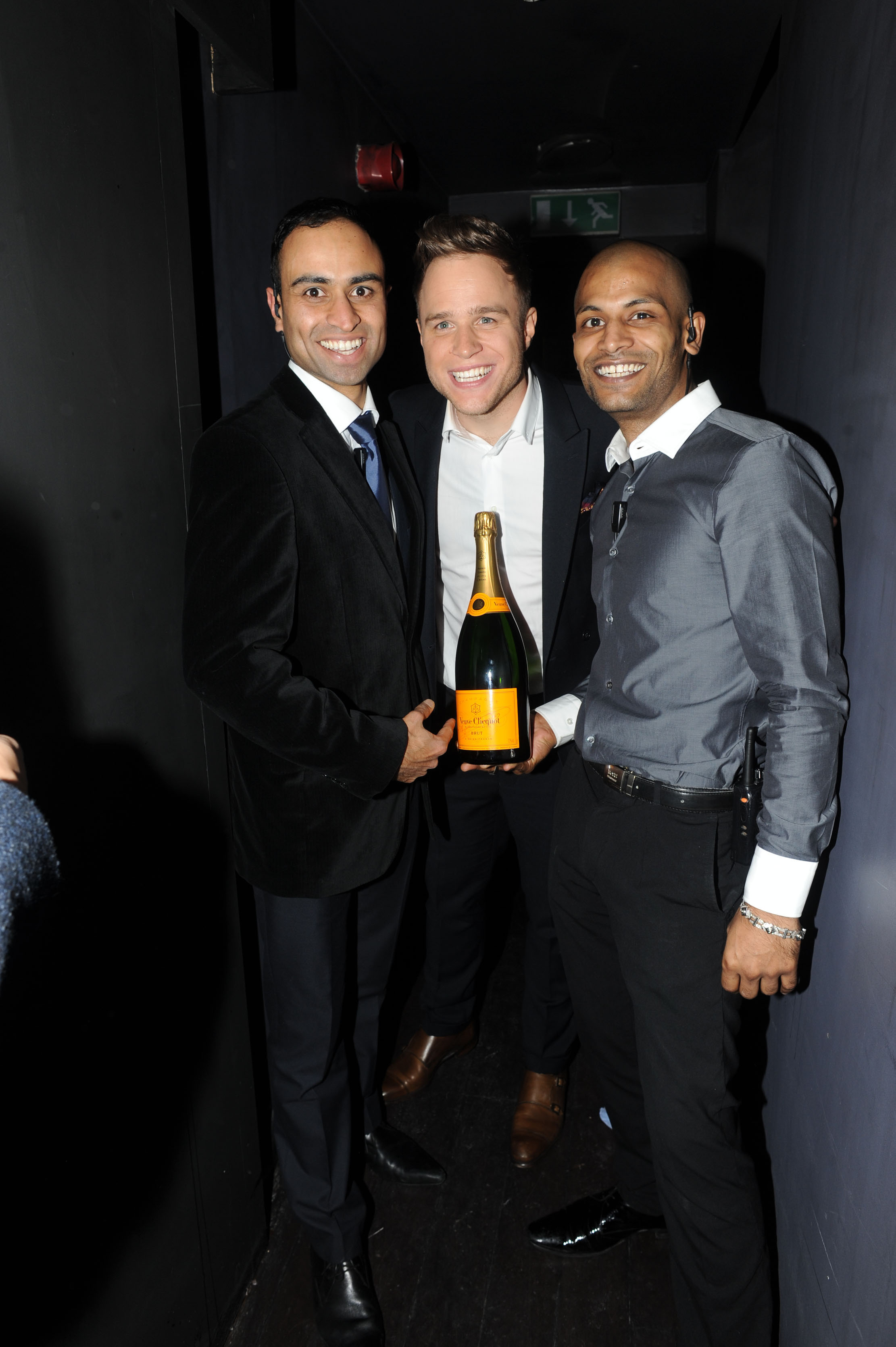 Group celebrating with champagne at The Main Bar, Bijou Club - networking event.