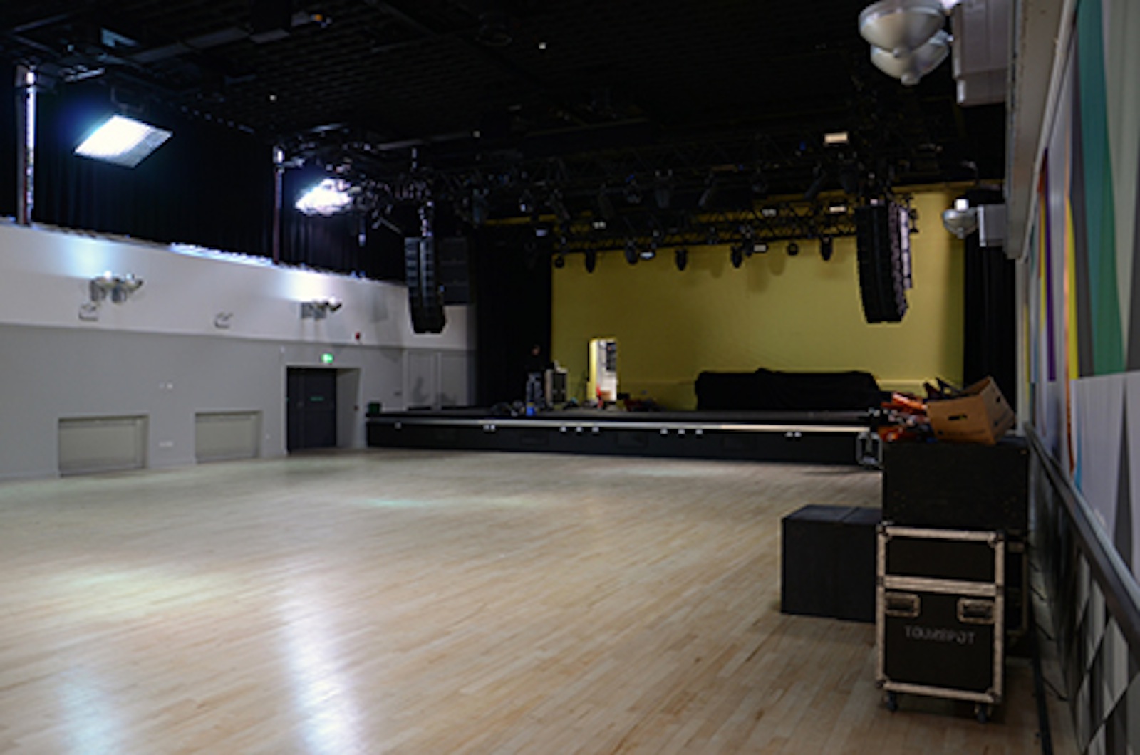 Spacious event venue in Liverpool with polished wooden floor for conferences and performances.