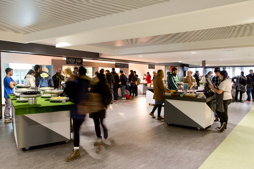 Courtyard at Guild of Students Liverpool, bustling event space with food stations for networking.