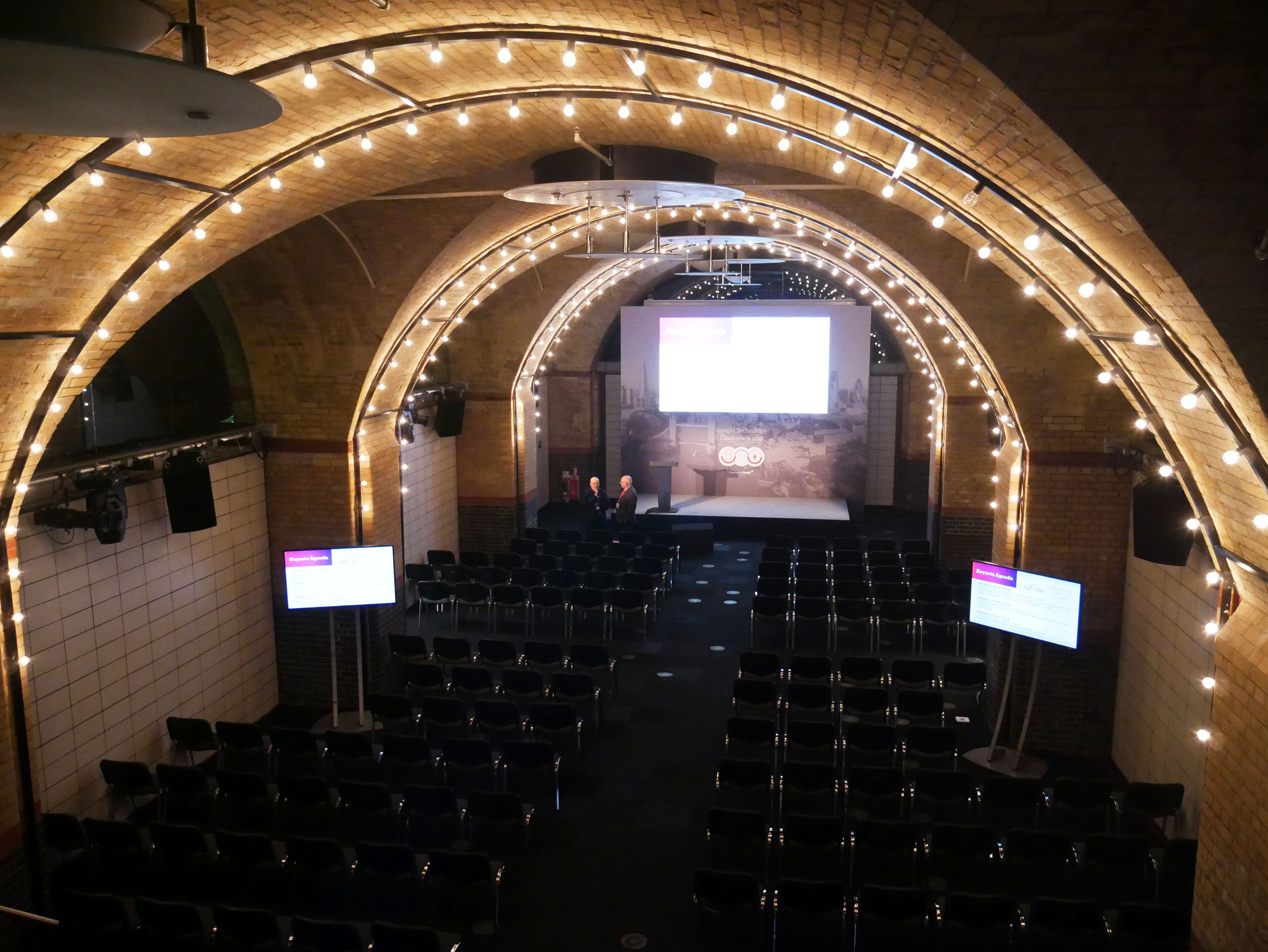 Event space at The Vault, arched ceiling with string lights, ideal for meetings and networking.