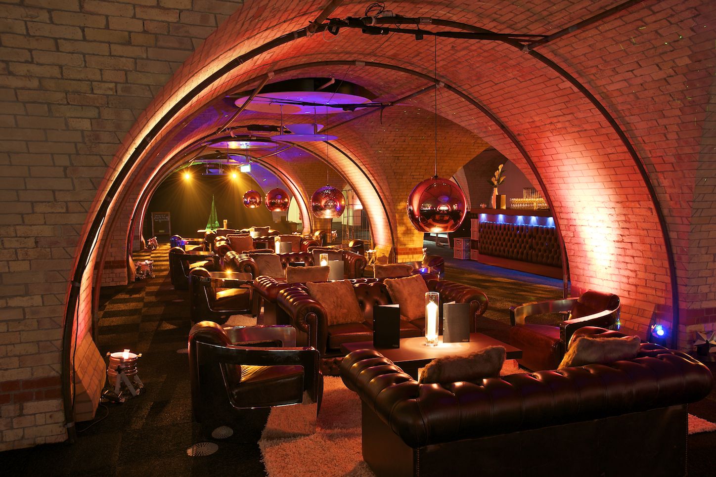 Stylish arched venue with warm lighting for upscale events and gatherings.