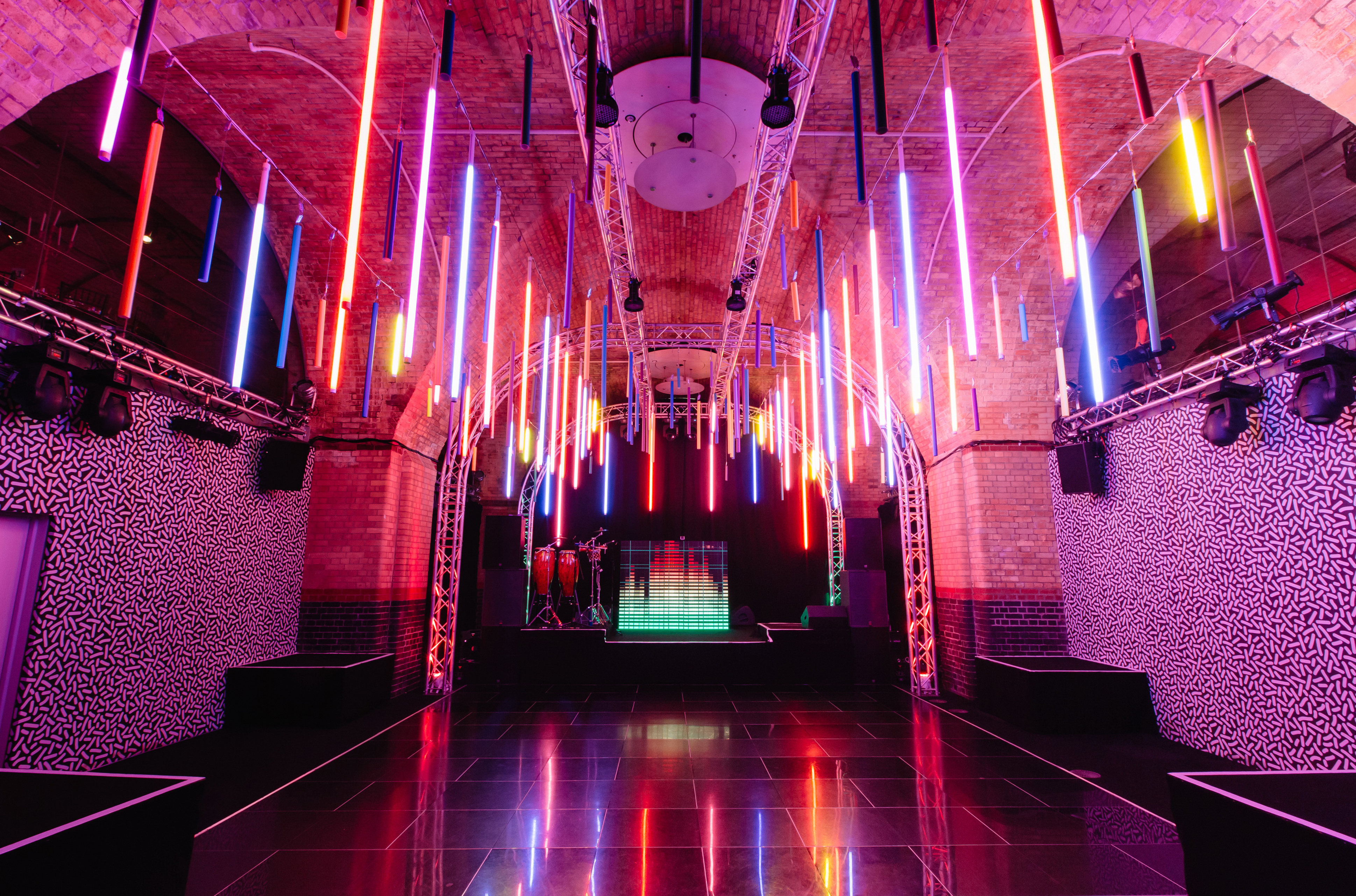 Vibrant event space at The Vault, featuring dynamic lighting for corporate parties.