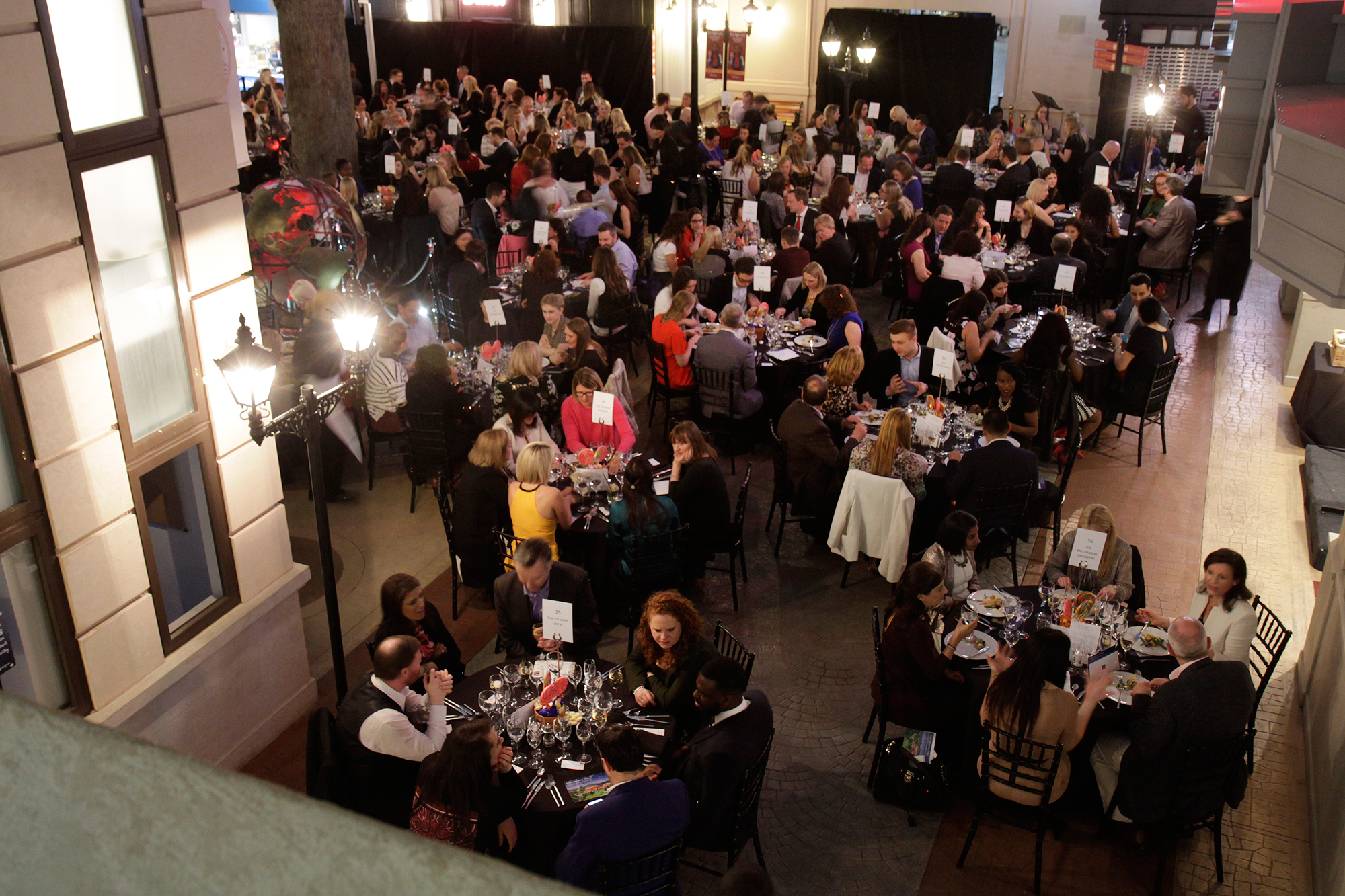 Elegant banquet event in KidZania London with sophisticated decor and networking atmosphere.