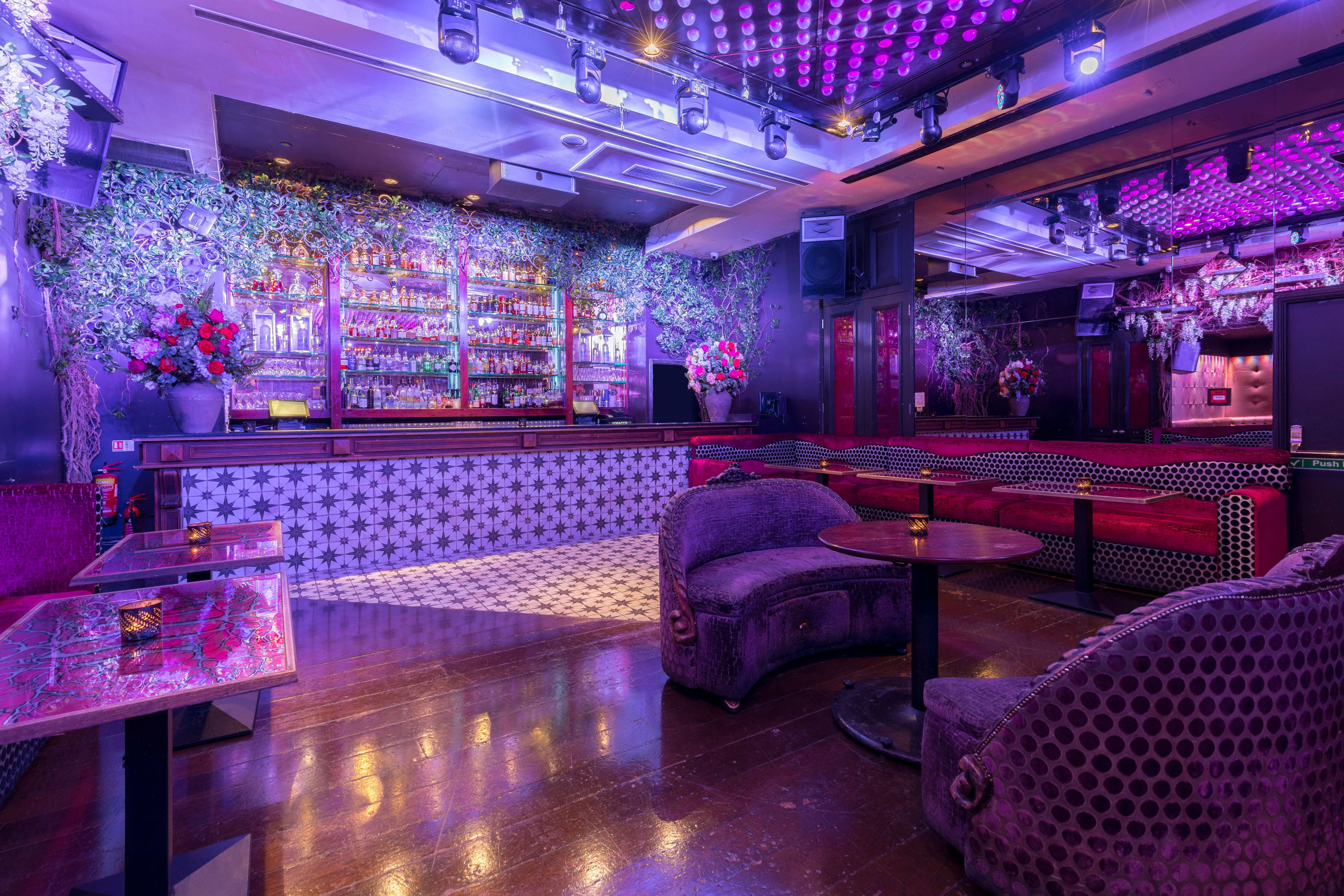 Vibrant event space with stylish seating and floral decor for cocktail receptions.