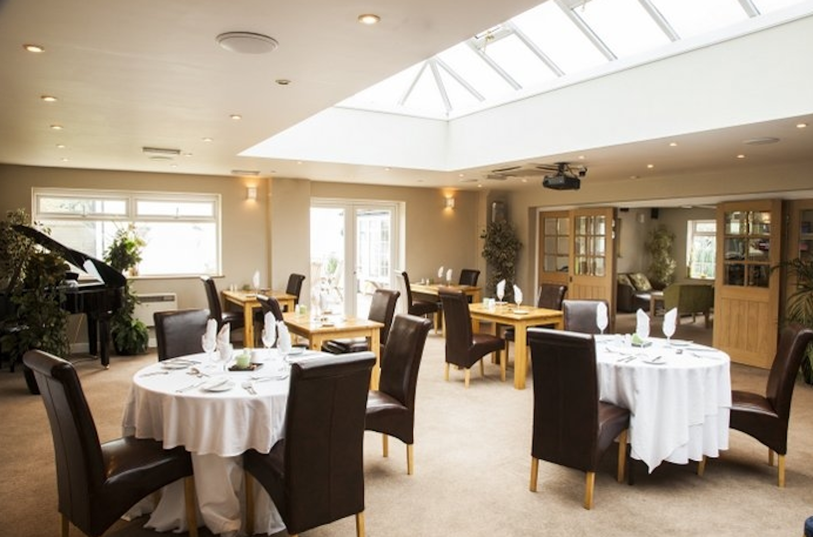 Orchard Suite dining space with elegant decor for corporate events and intimate gatherings.