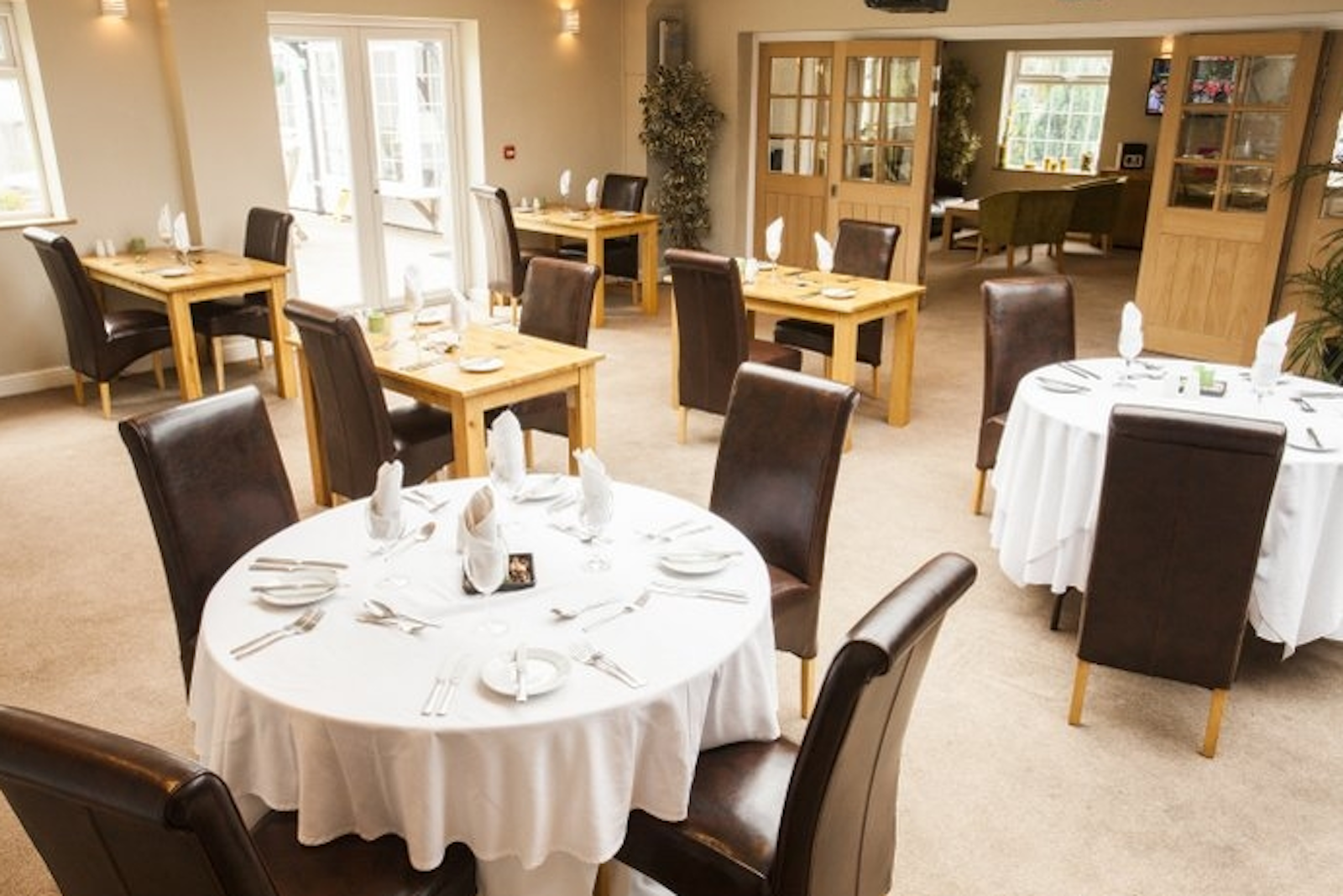 Orchard Suite dining area at The Limes Lodge, ideal for corporate events and gatherings.