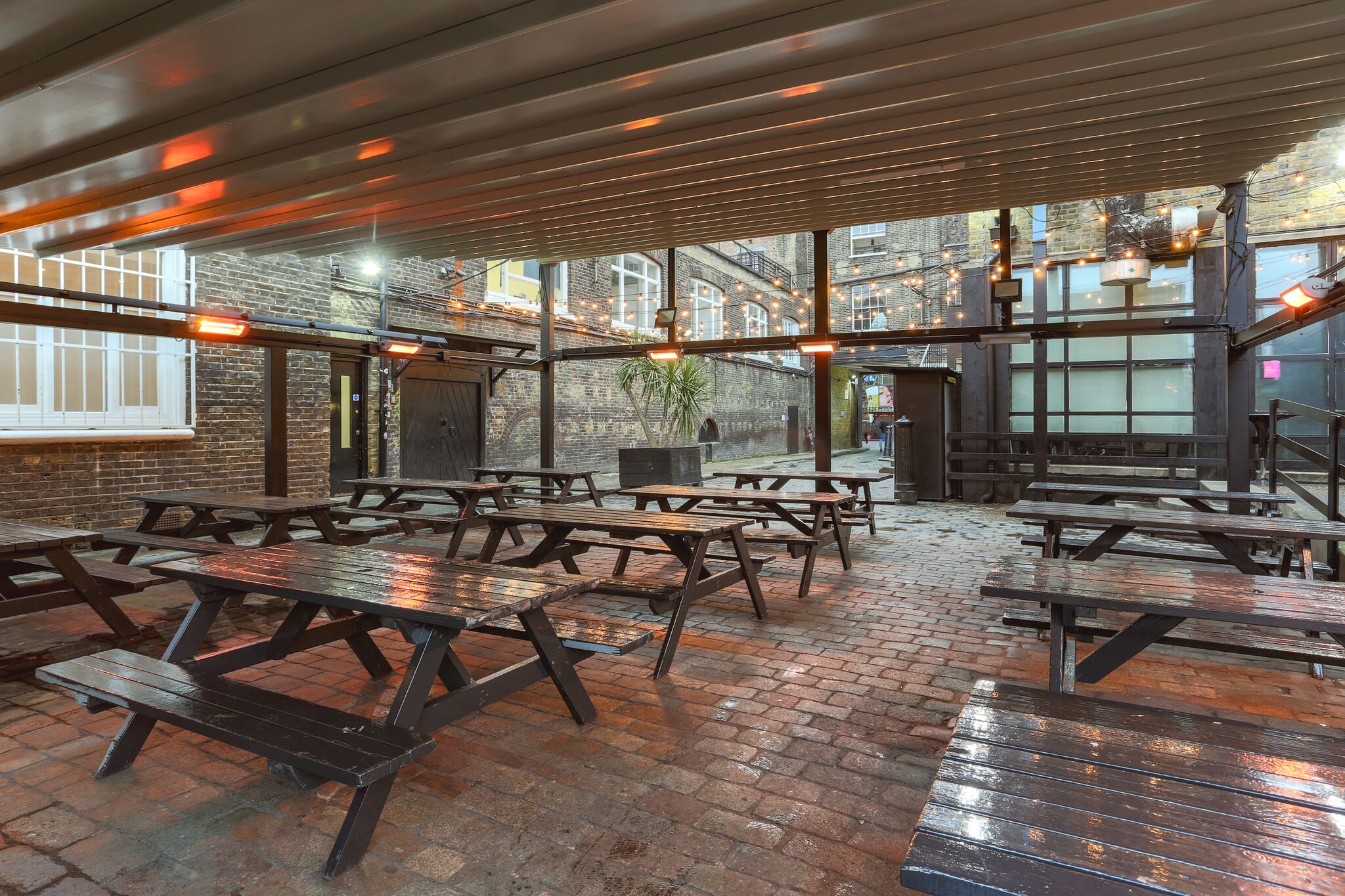 Versatile outdoor event space with picnic tables at 93 Feet East for casual gatherings.