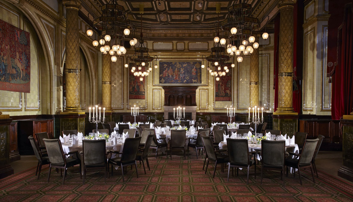 Elegant Whitehall Suite banquet hall with vintage chandeliers, ideal for weddings and galas.