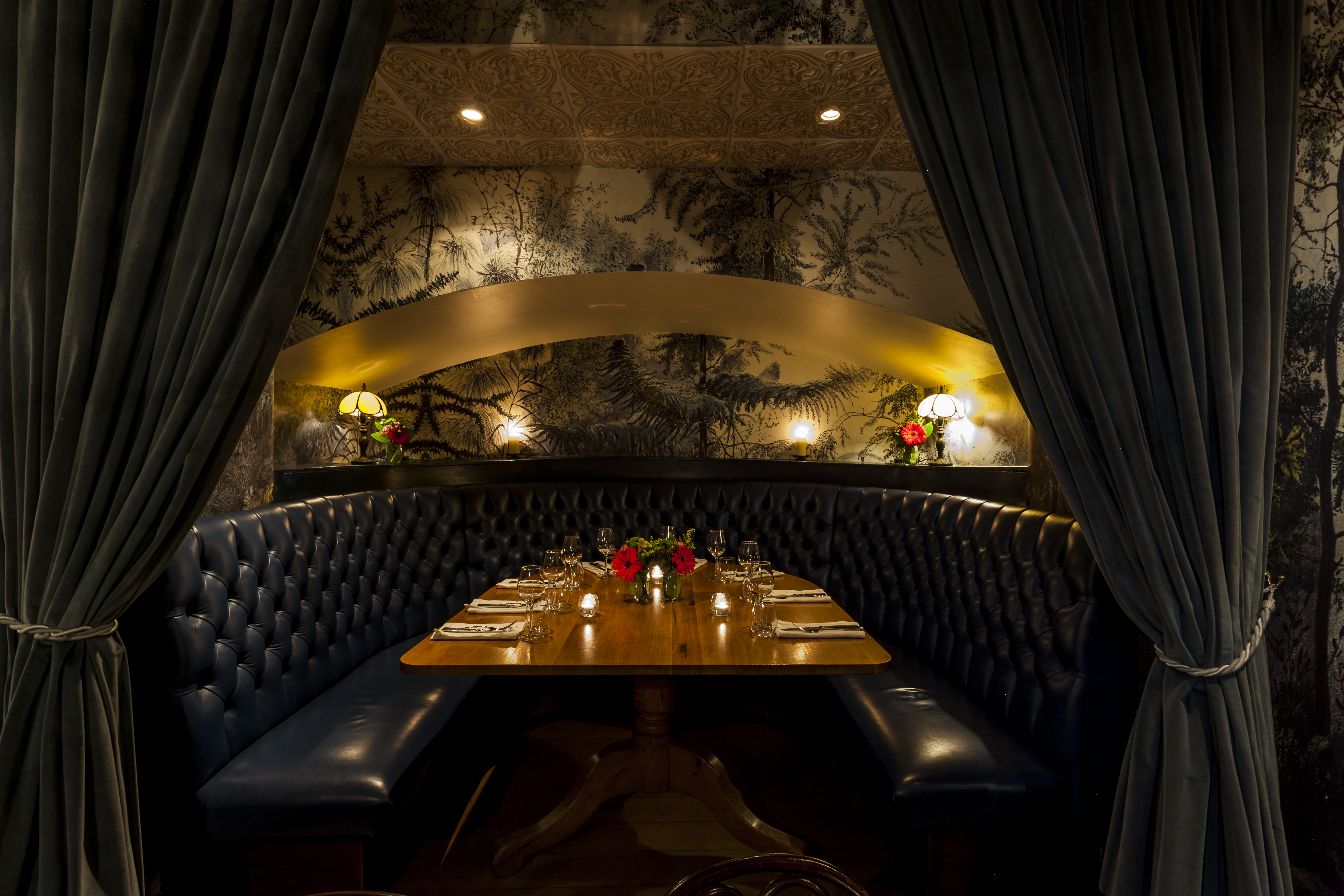 Private dining space in GOAT with plush seating, ideal for intimate events and gatherings.
