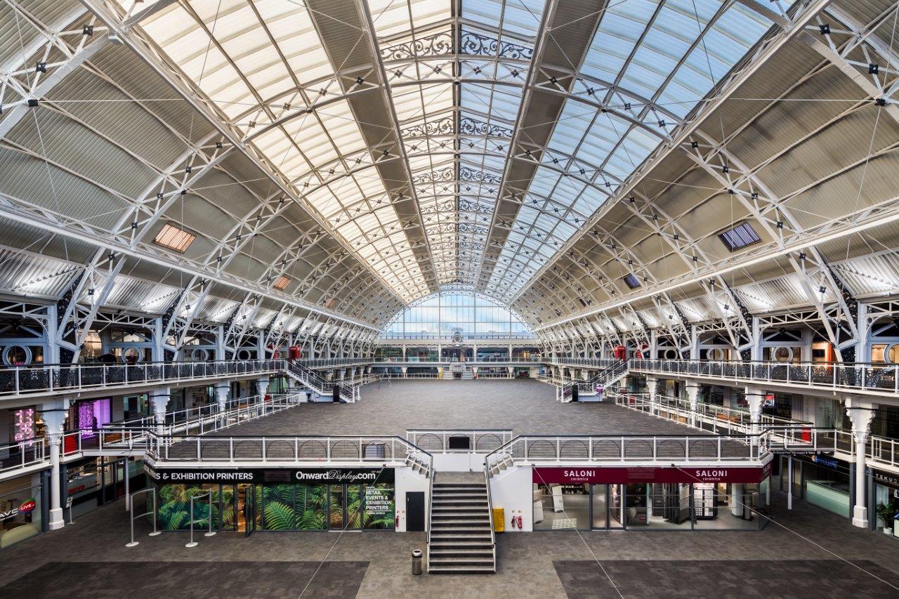 Spacious Mezzanine venue with high ceilings for trade shows and networking events.