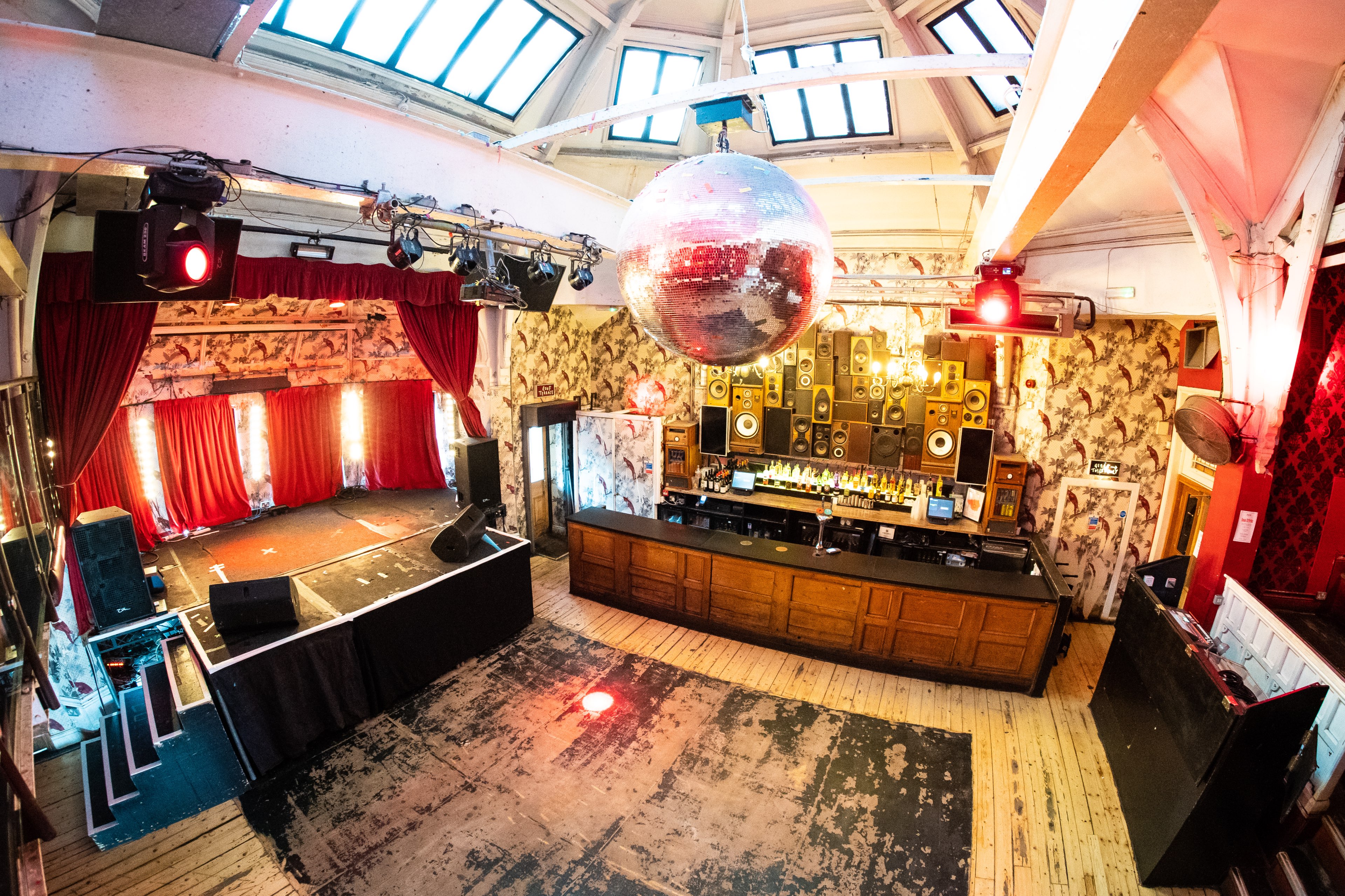 The Music Hall at The Deaf Institute with a spacious dance floor and vibrant decor.