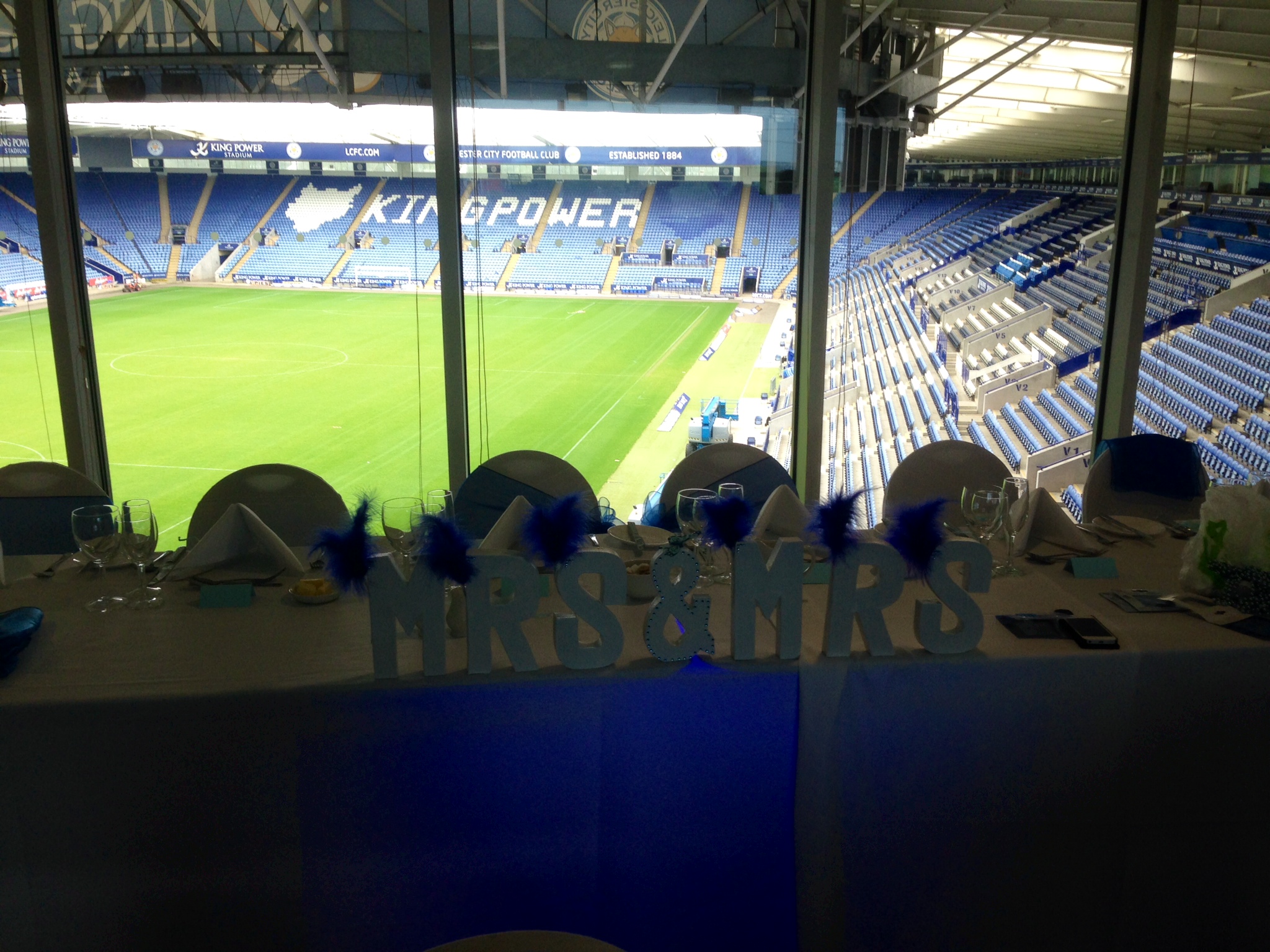 Elegant wedding reception table at Walkers Hall, King Power Stadium, with "MR & MRS" decor.