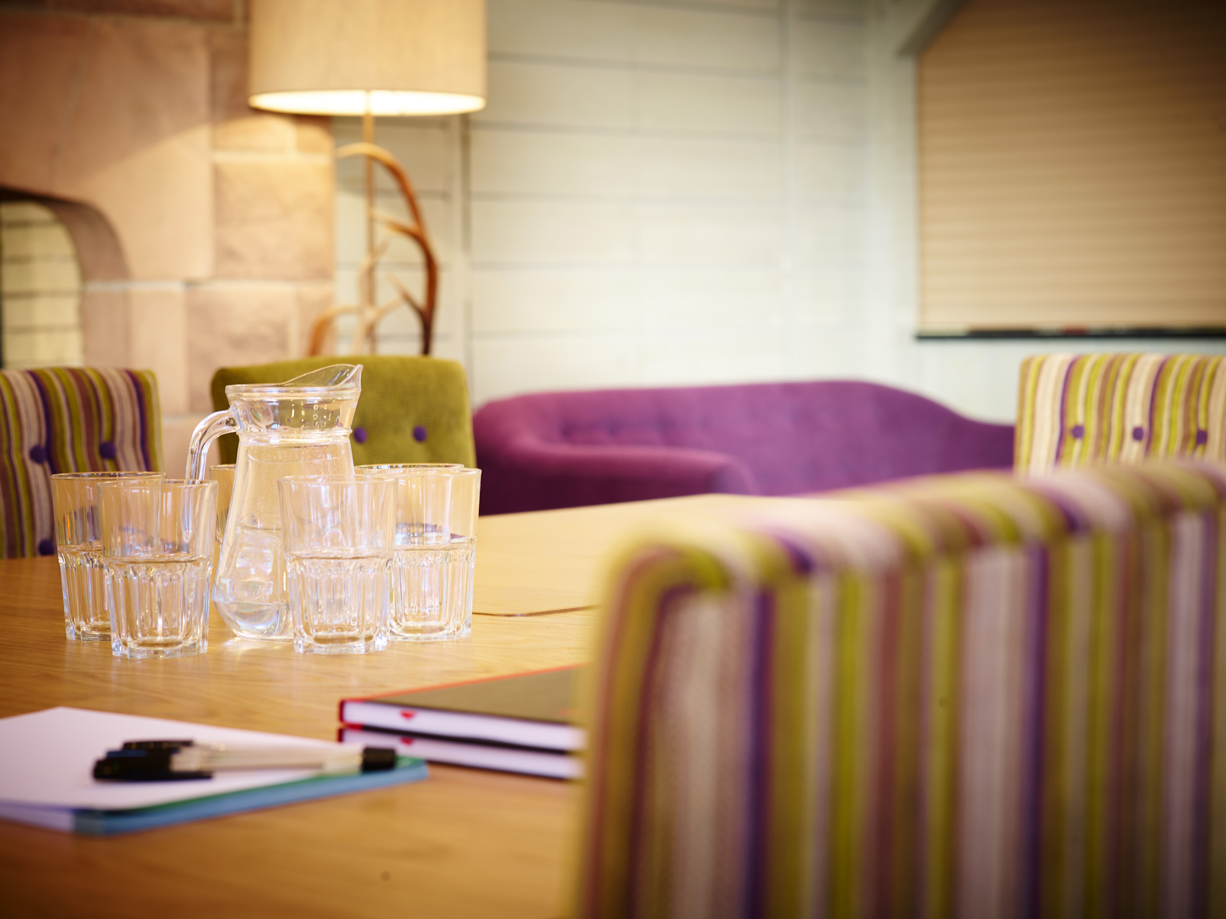 Forest Pavilion meeting space with vibrant chairs for creative brainstorming sessions.