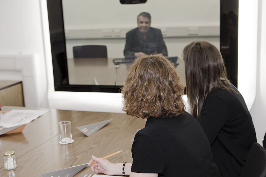 Modern meeting setup in Bournville Suite with video conference technology for events.