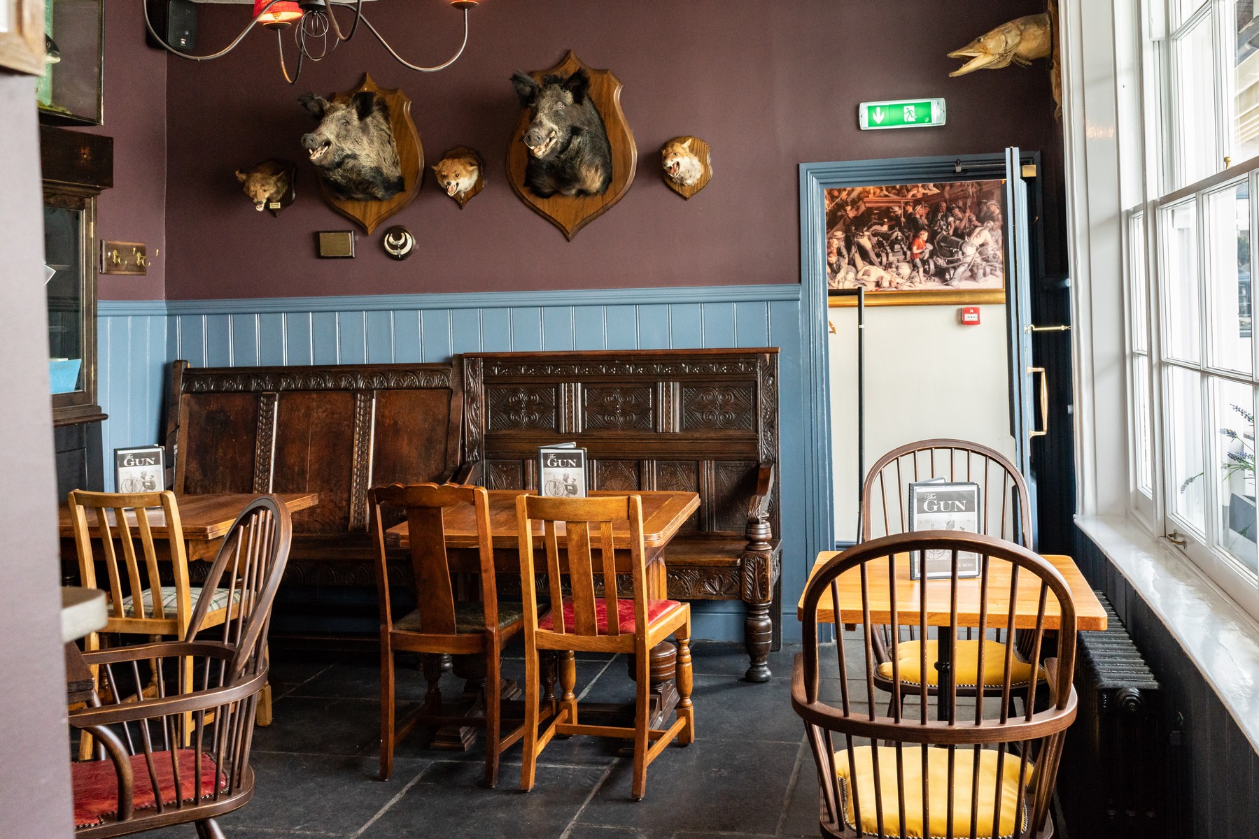 Cozy Red Room venue with warm wood tones for intimate gatherings and casual meetings.