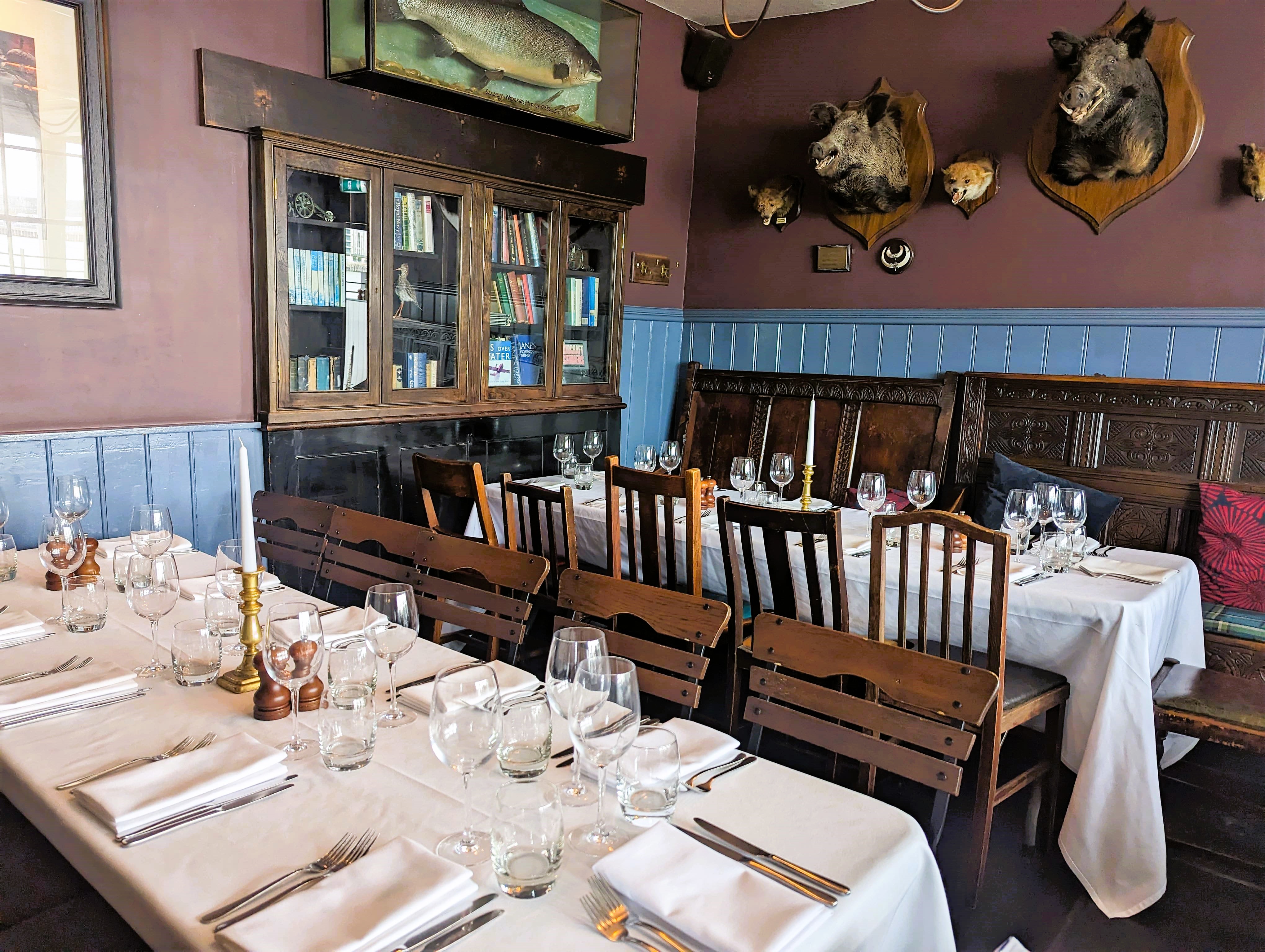 Charming Red Room dining space with rustic decor for intimate gatherings and events.
