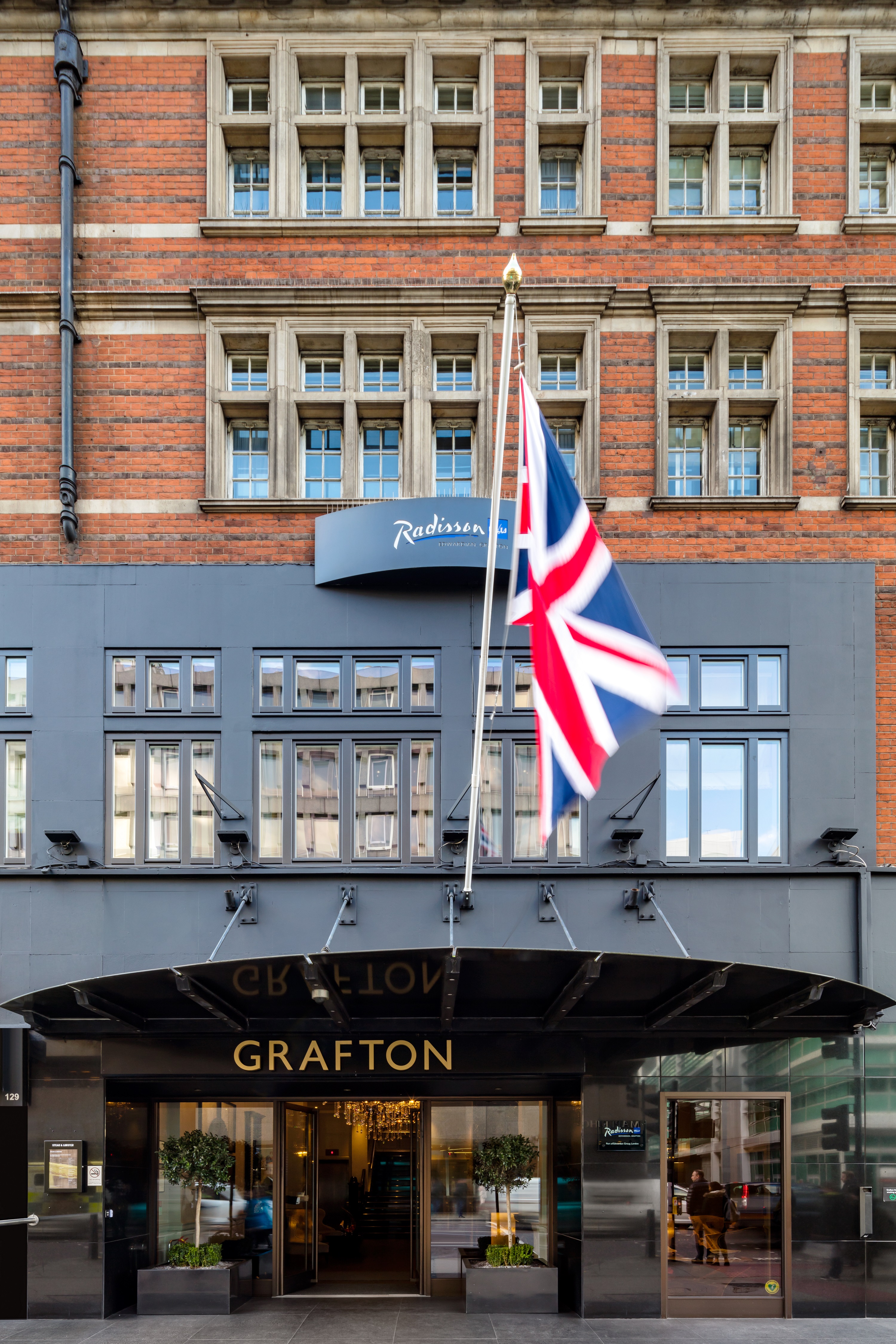 Tavistock Suite at Radisson Blu, London - modern venue for corporate events with British flag.