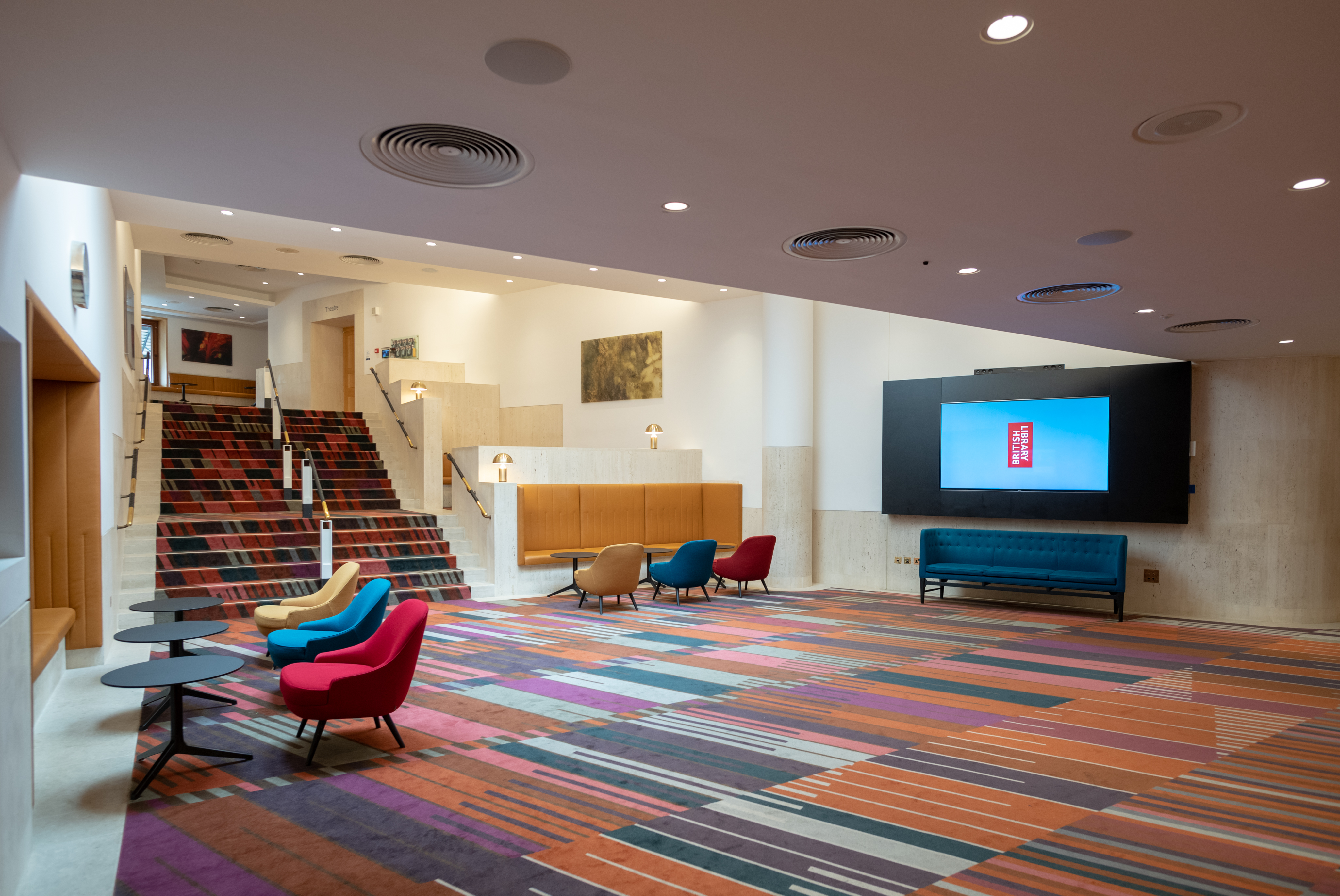 Pigott Theatre lobby with vibrant carpet, ideal for corporate meetings and social events.