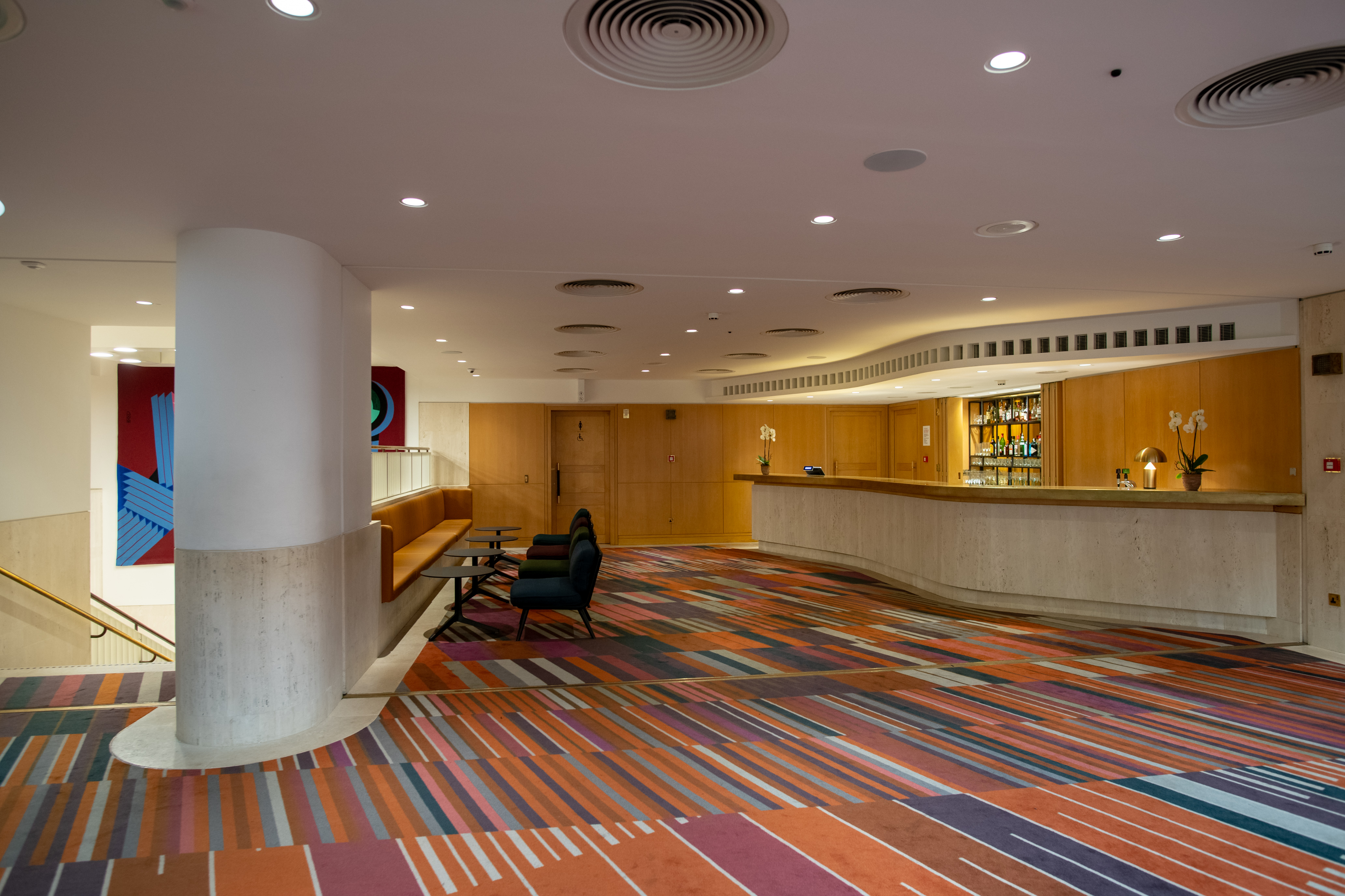 Pigott Theatre lobby at British Library, vibrant carpet, ideal for events and networking.