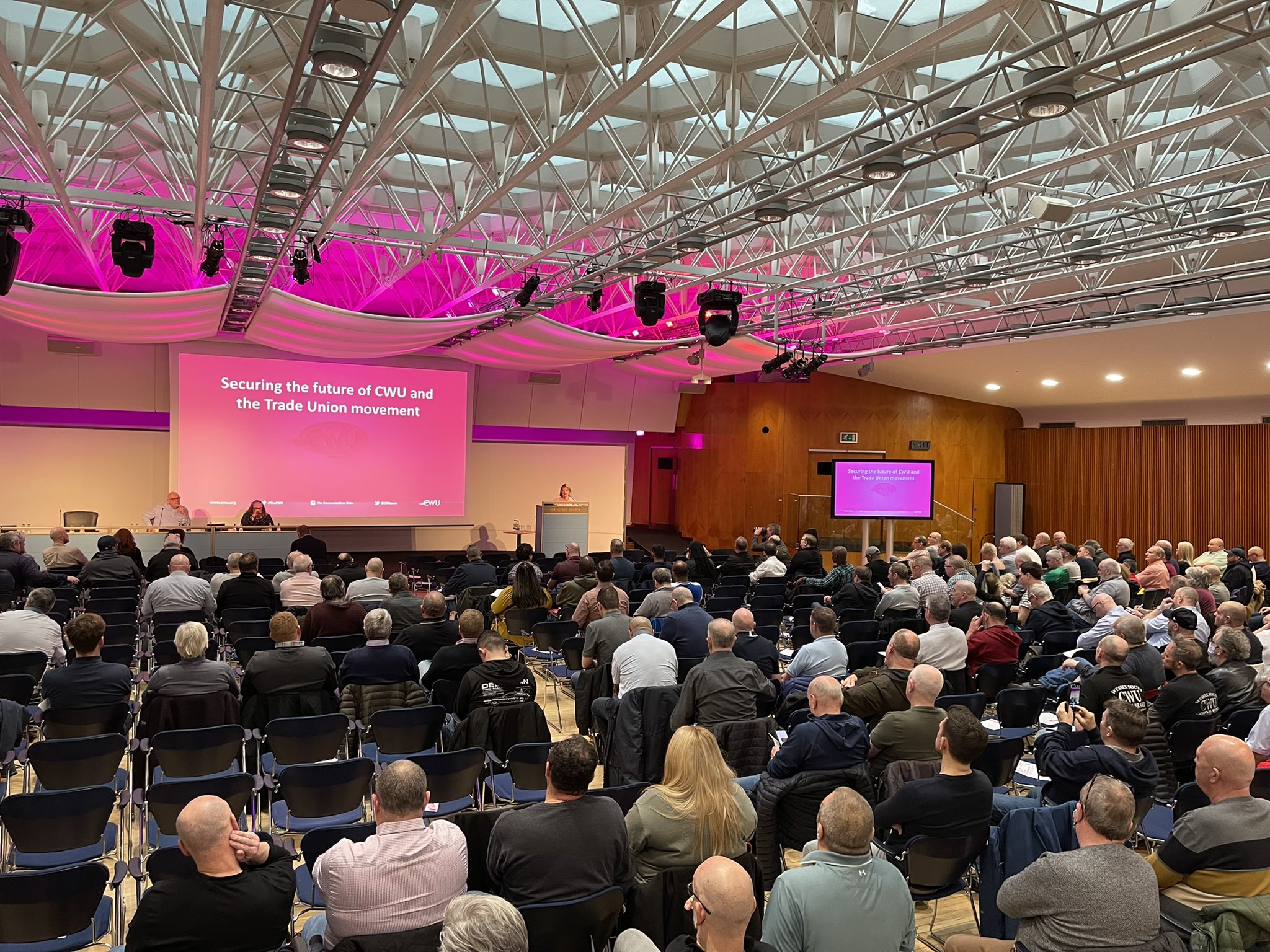 Congress Hall conference with modern lighting, showcasing industry presentation event.