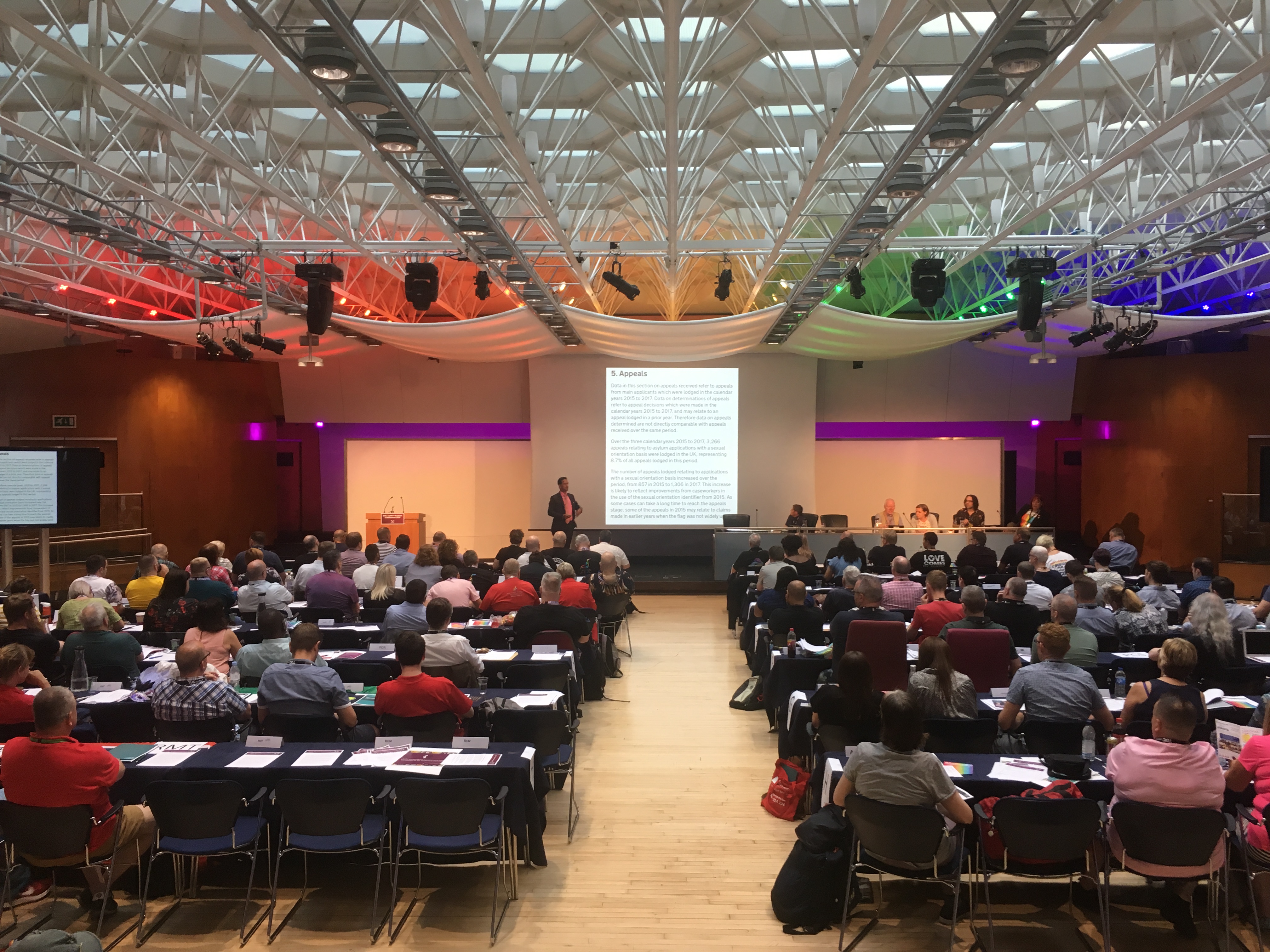 "Congress Hall conference with engaging speaker, modern venue for networking events."