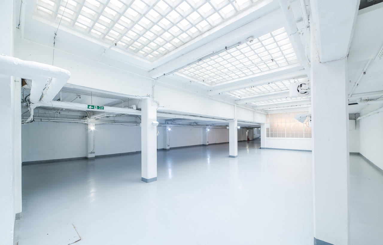 Spacious event venue in The Vinyl Factory Soho with high ceilings for conferences and exhibitions.