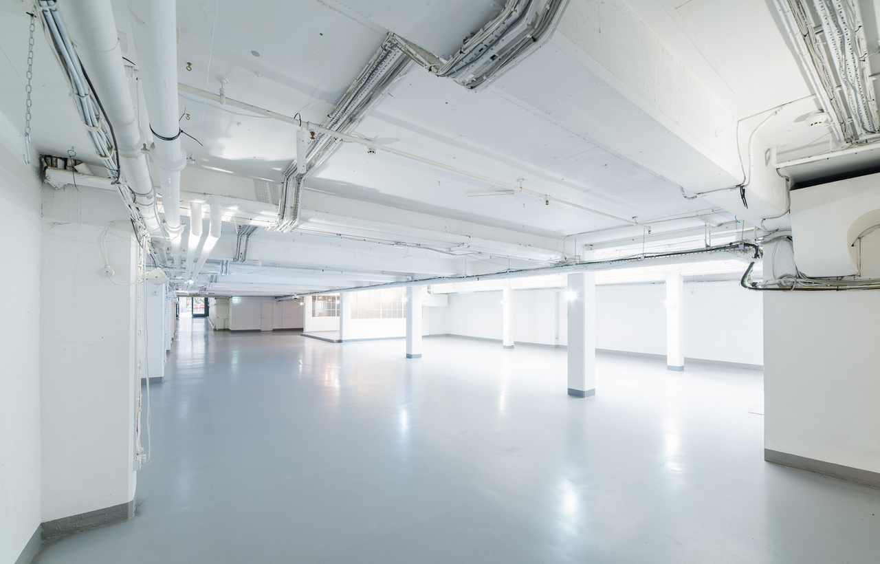 Spacious minimalist venue at The Vinyl Factory Soho for conferences and exhibitions.