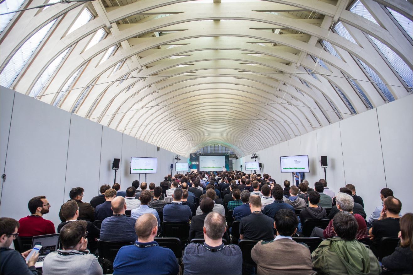Conference setting at The Gallery, Old Billingsgate with engaged audience and modern architecture.