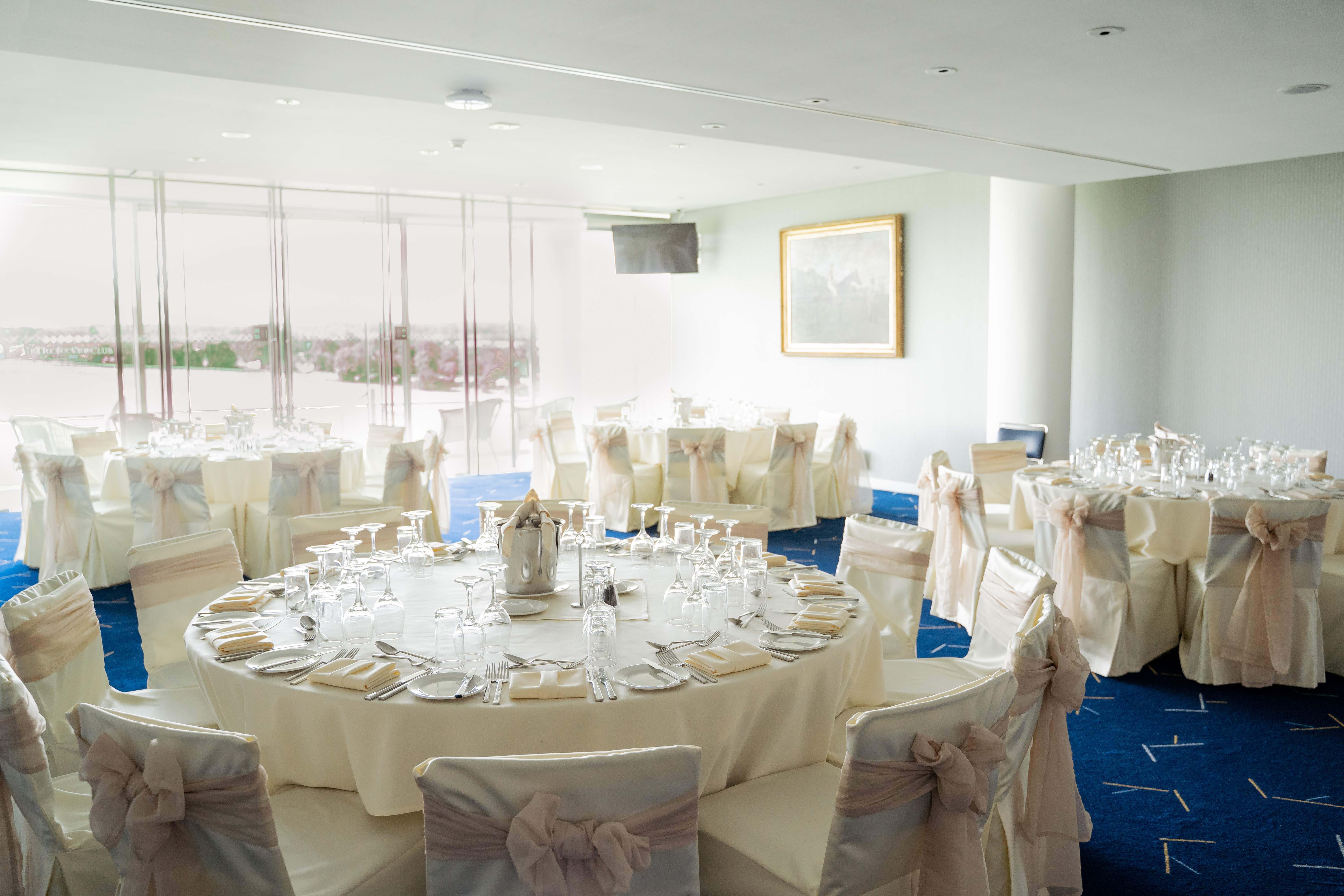Elegant banquet room in The Royal Box, Epsom Downs for weddings and corporate events.