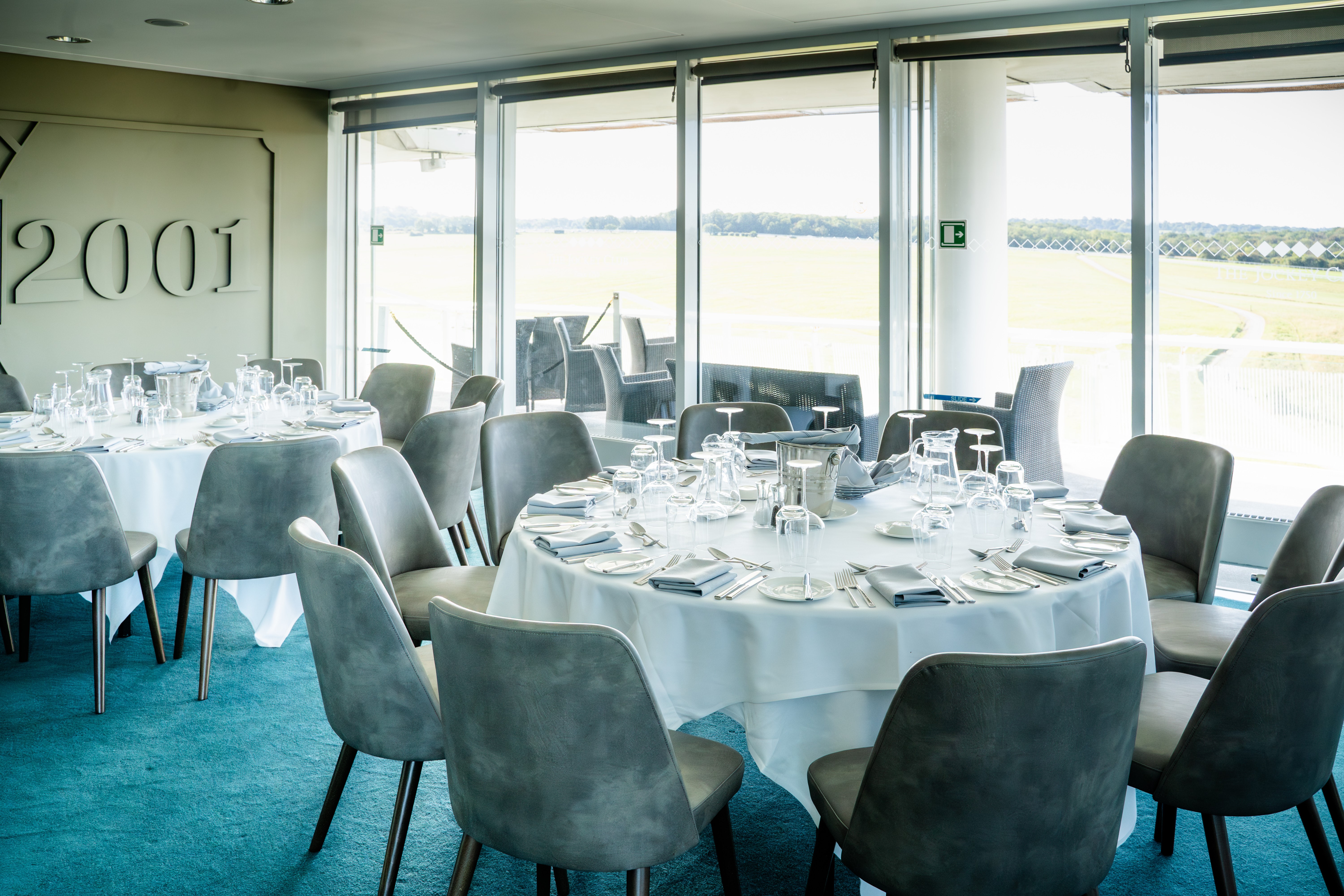 Queen's Double Box at Epsom Downs: elegant dining space for corporate events and celebrations.